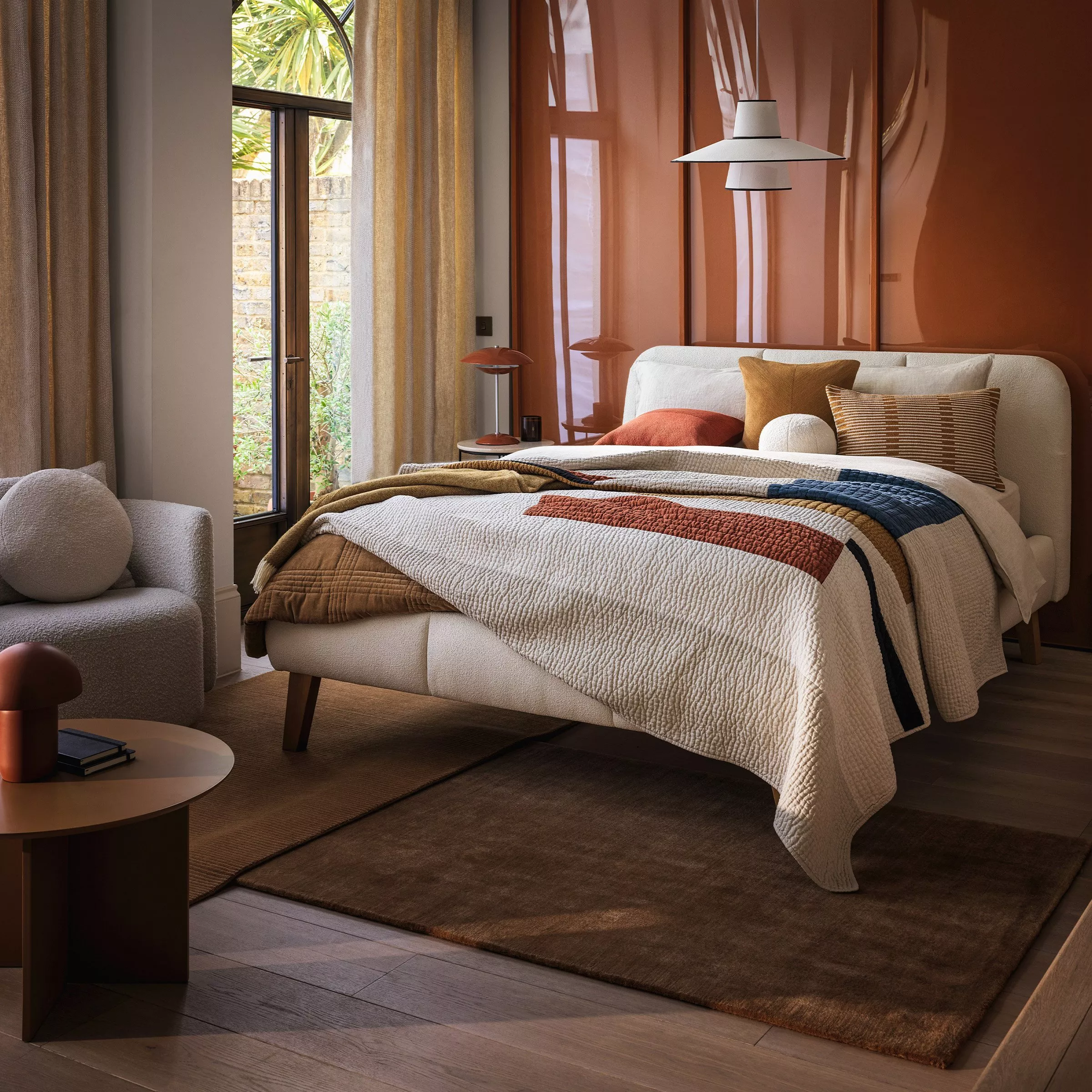Mattress with fur throw on and pillows