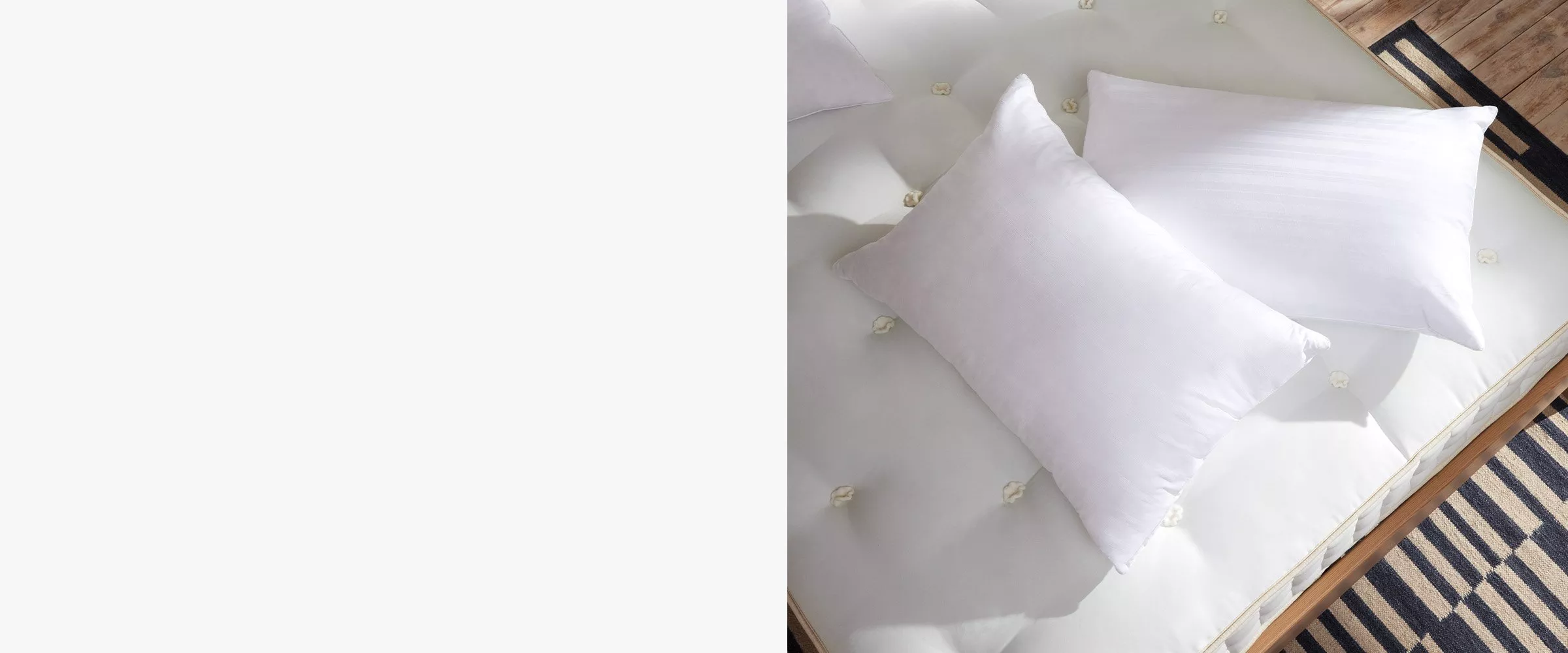 Two pillows scattered on a mattress