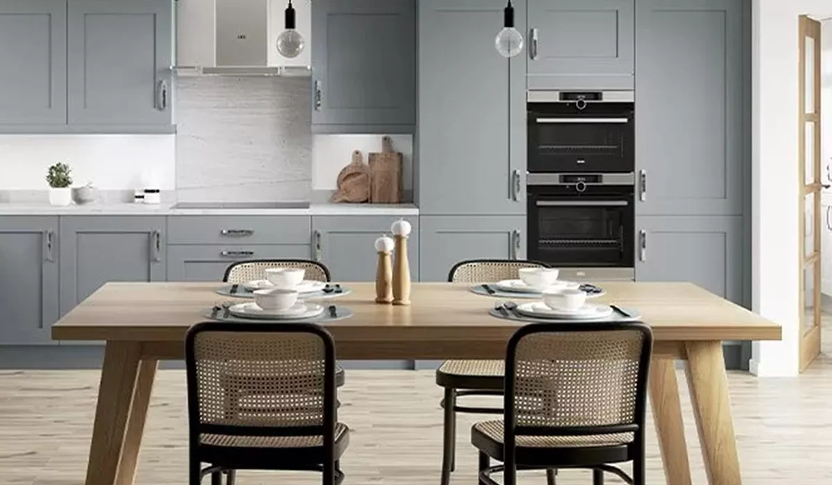 Grey fitted kitchen with dining table