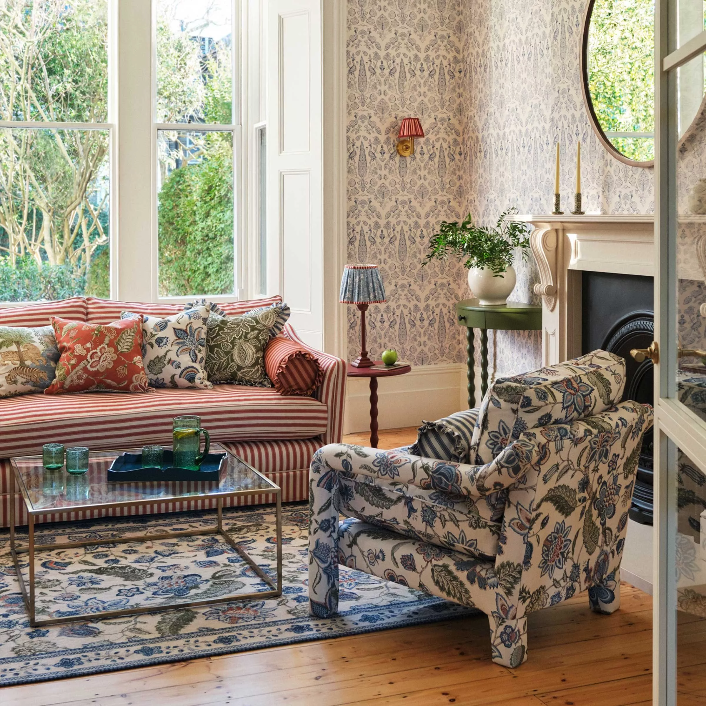 The White Company products gathered on a table including a lit candle and body lotion