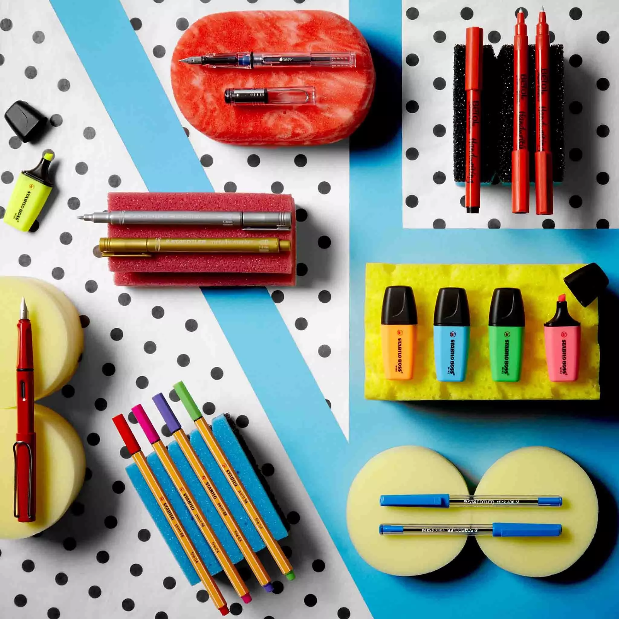 Selection of pens and highlighters on a table 