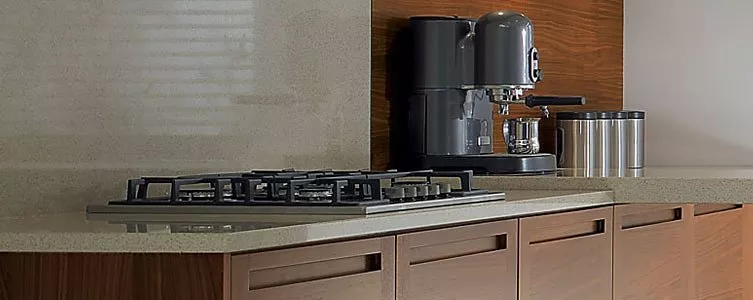 Modern kitchen cooker with ceramic hob, oven controls and integrated cabinetry in minimalist flat design illustration