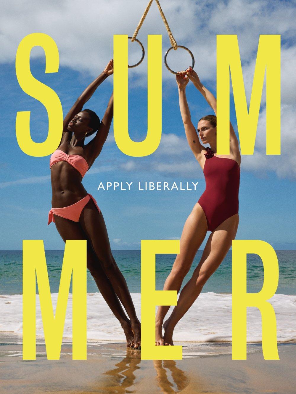Image of two models holding onto some rope standing by the sea wearing swimsuits and a title of Summer across the image