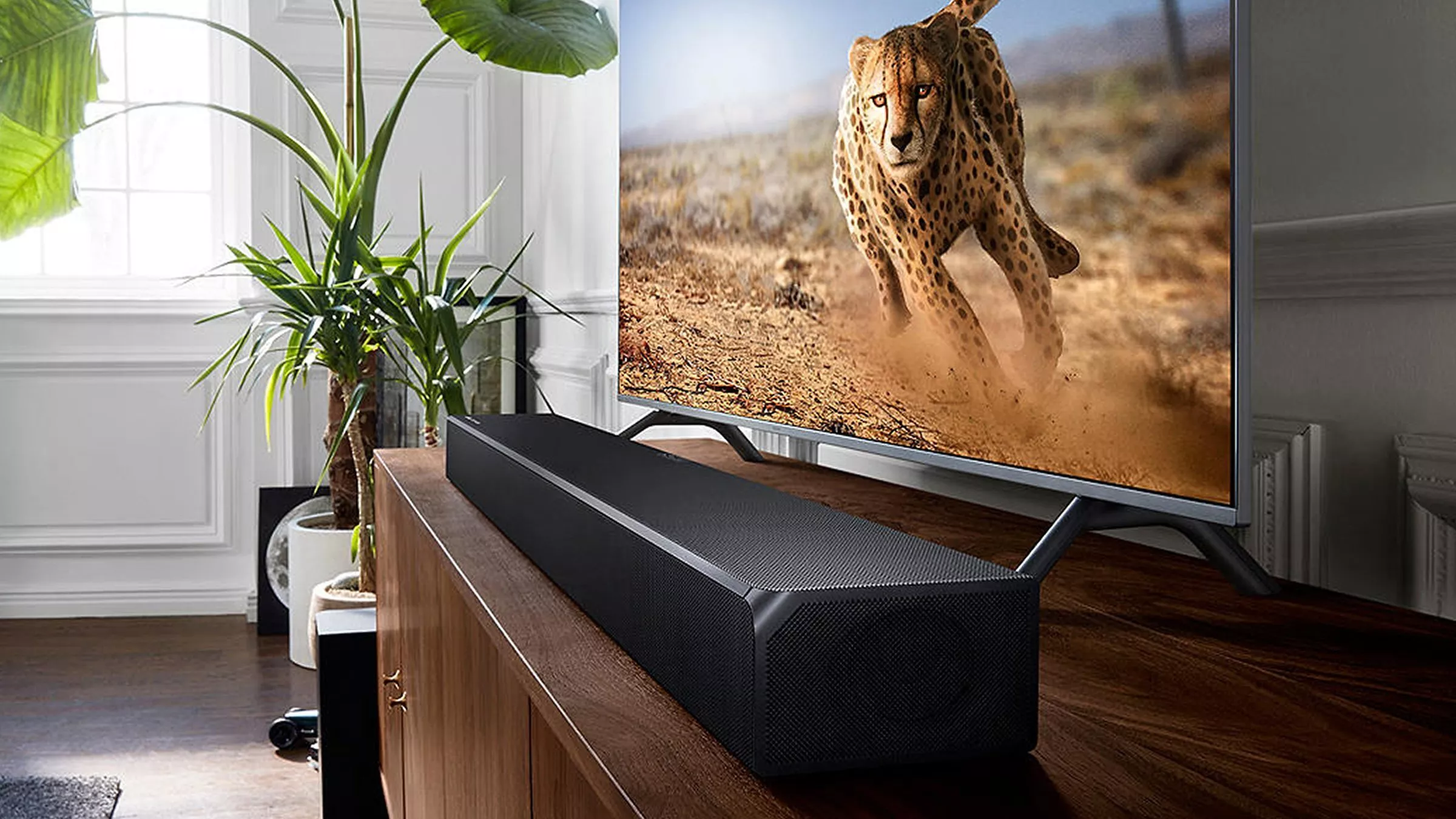 TV on sideboard with soundbar 