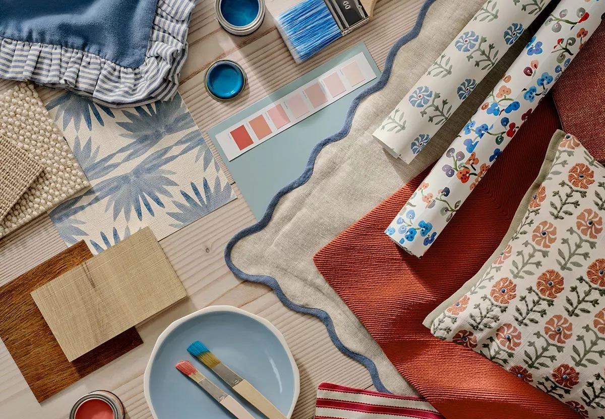 Table scattered with paint and fabric swatches