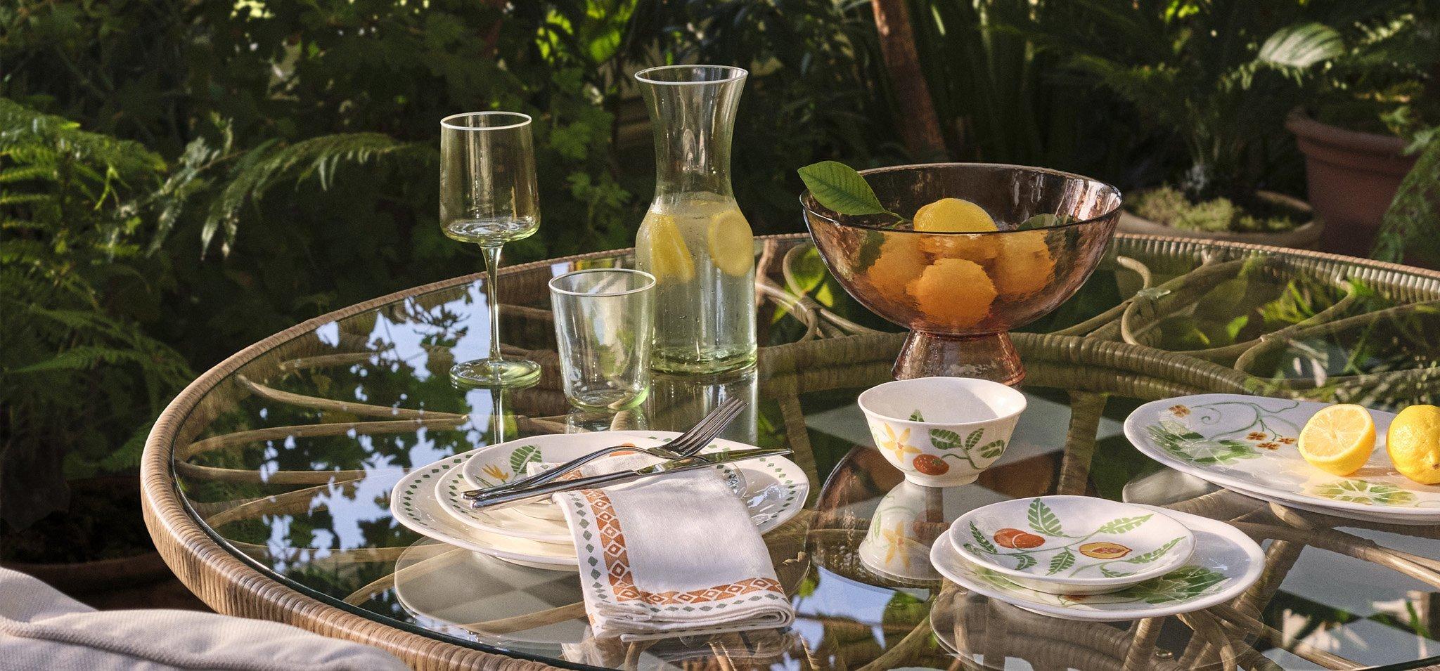 Wicker table and chairs with summer drinks set out