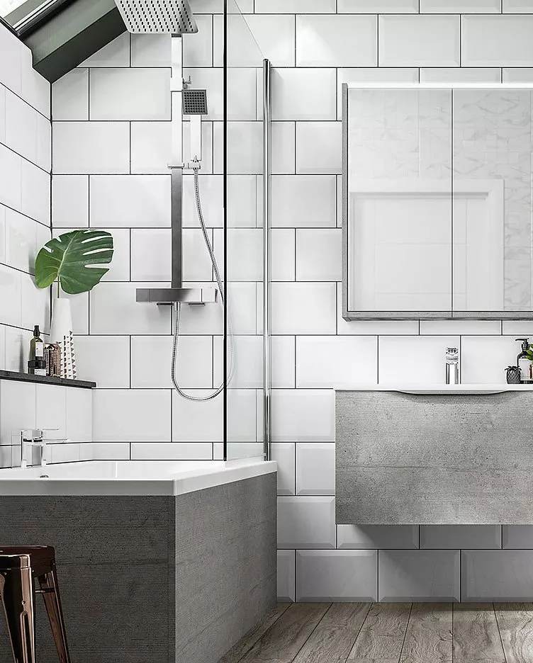 Modern bathroom with white tiles, a sleek shower, and a minimalist grey vanity. A plant adds a touch of greenery.