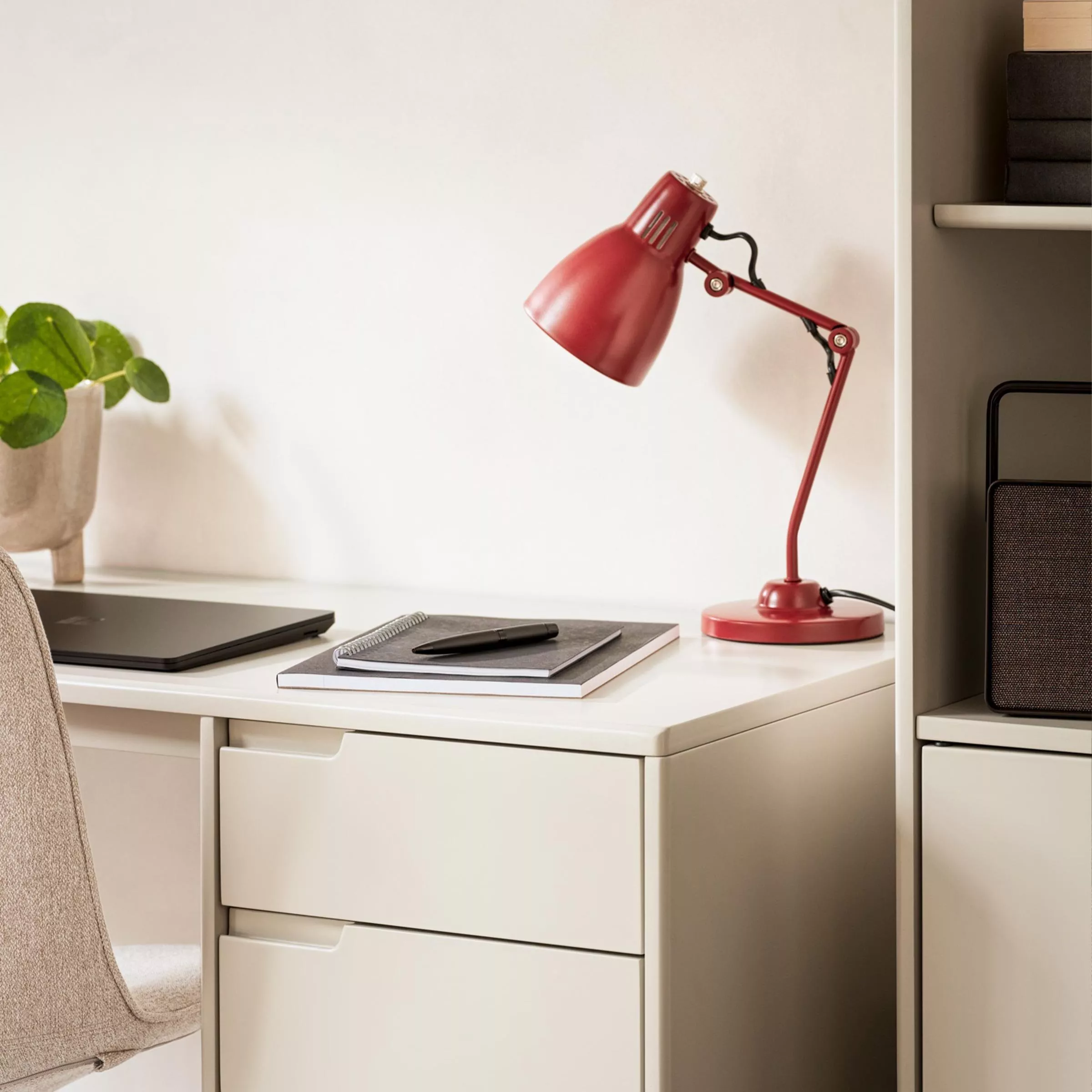 Desk with table lamp and notebook
