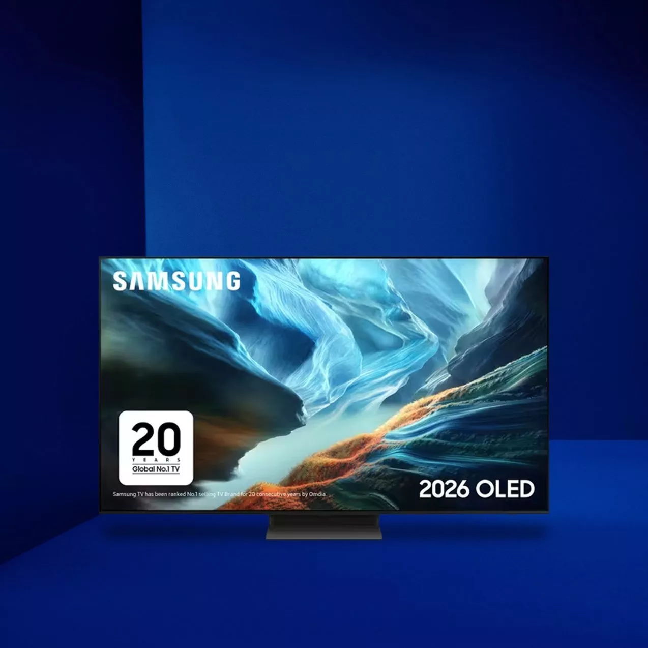 Samsung 2026 OLED TV on stand displaying vivid canyon landscape, with 20 years Global No.1 TV badge on screen