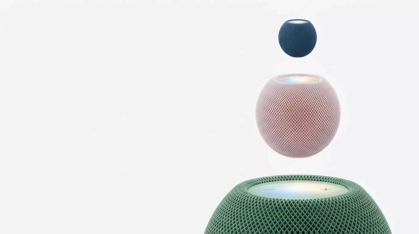 Three colourful smart speakers floating on a white background, modern wireless home audio devices in blue, pink and green