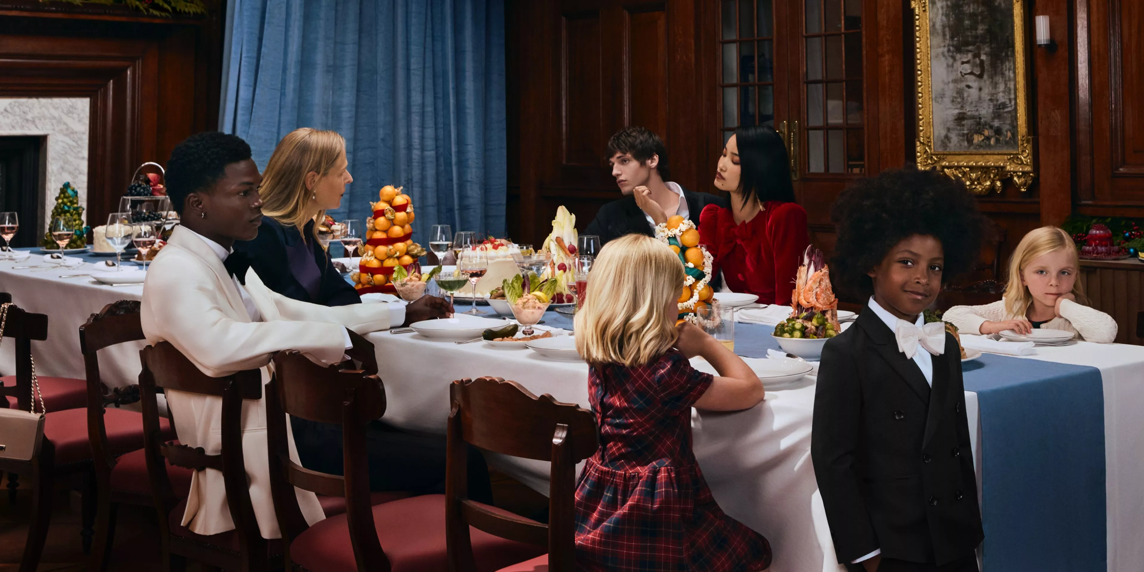 Guests sat around a Christmas dining table