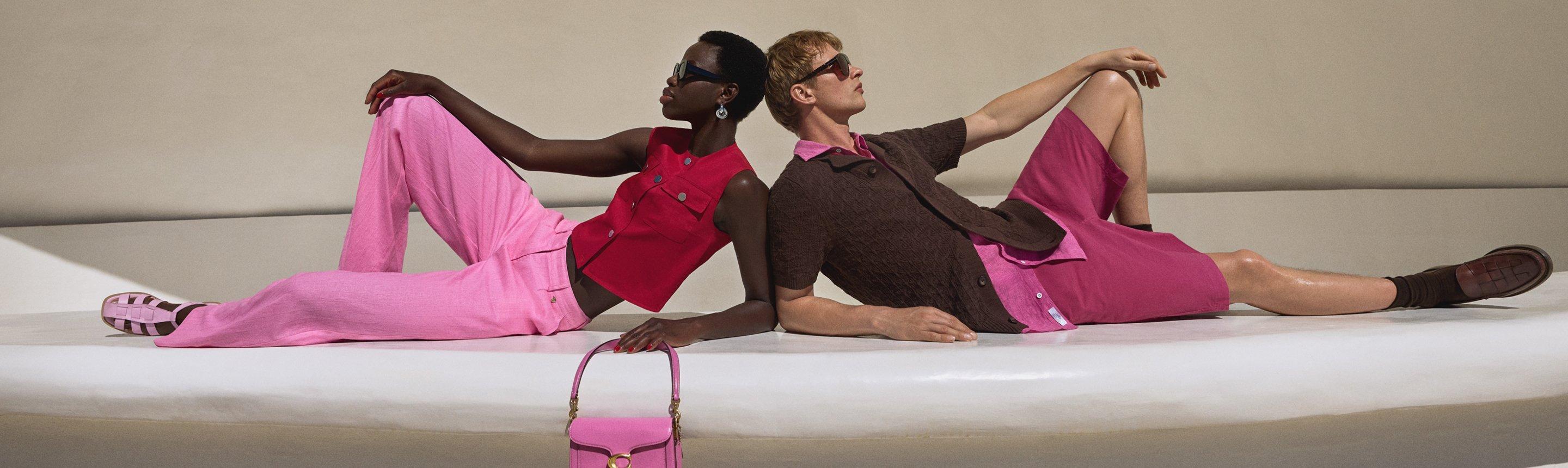 Male and female model wearing pink and brown co-ordinating summer outfits