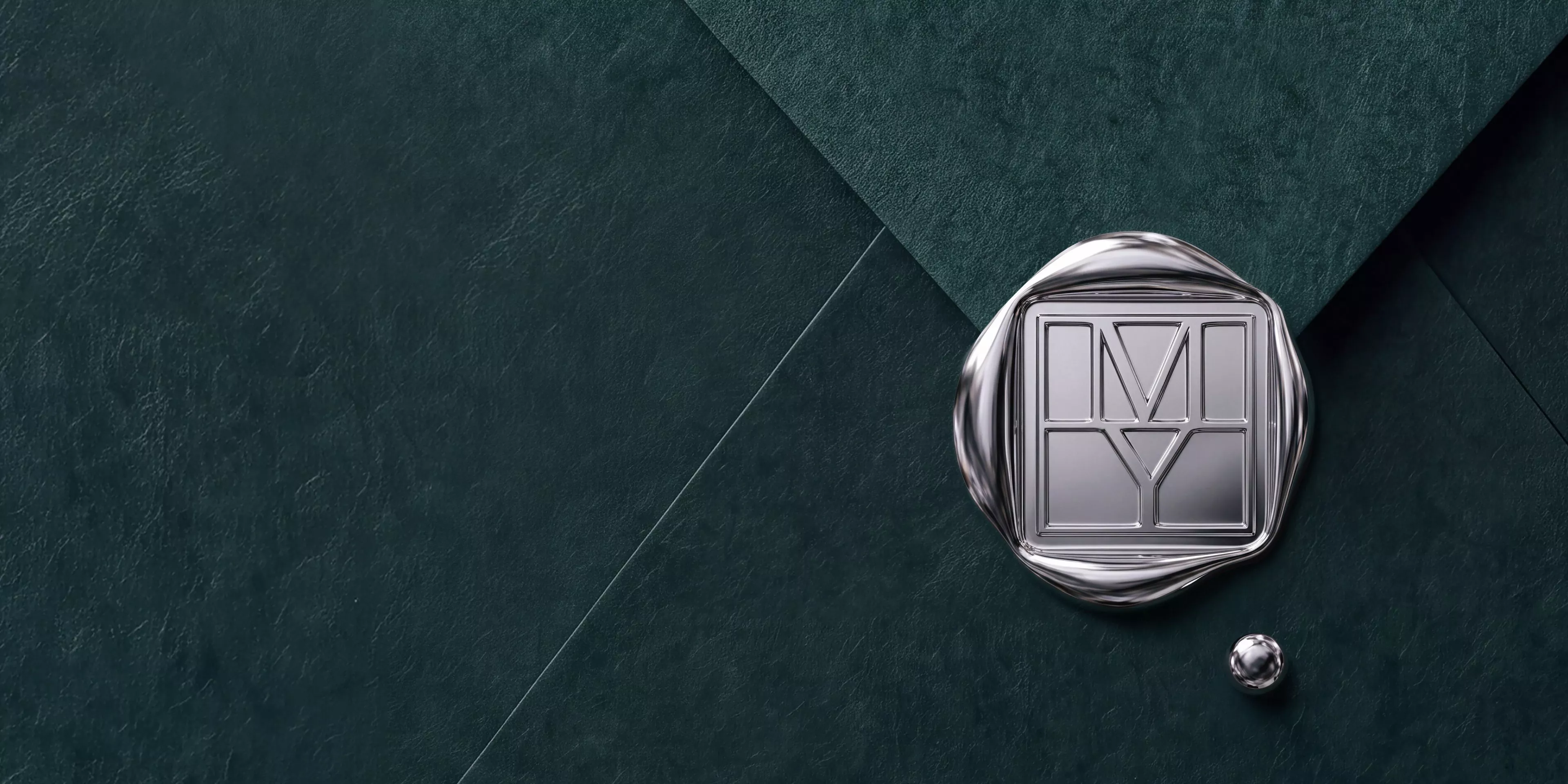 Silver wax seal with geometric emblem on dark green textured paper, luxury stationery branding backdrop