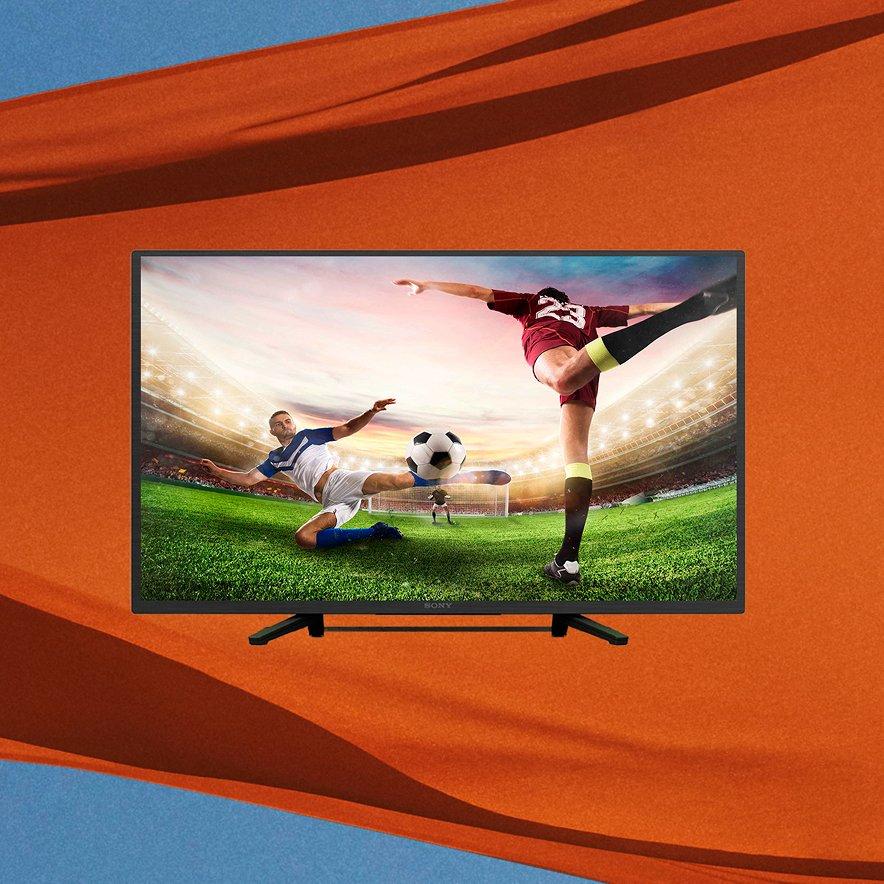 Tv infront of orange flag and blue sky