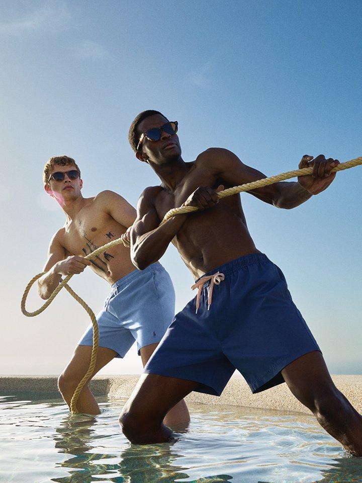 Two male models wearing swim shorts