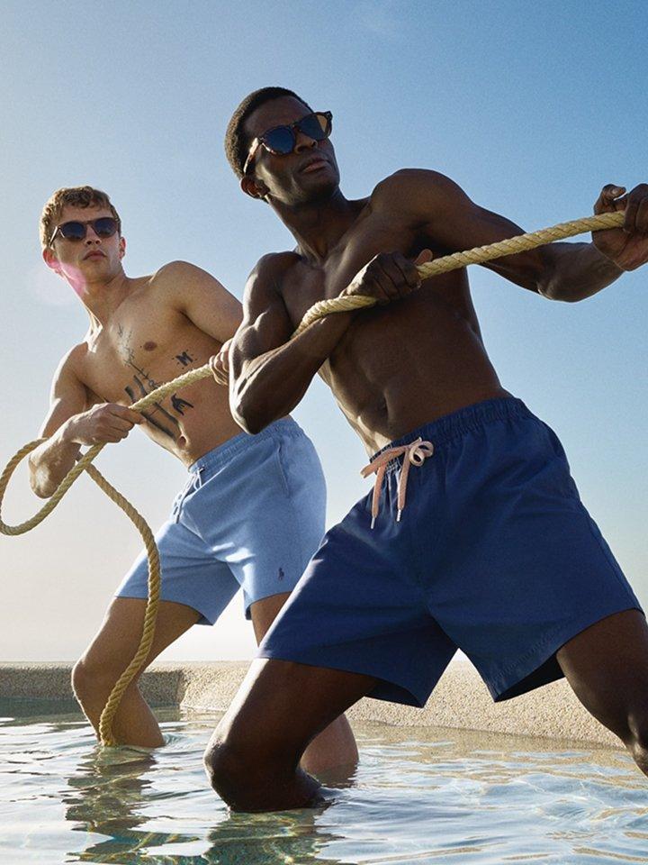 Two male models wearing swim shorts