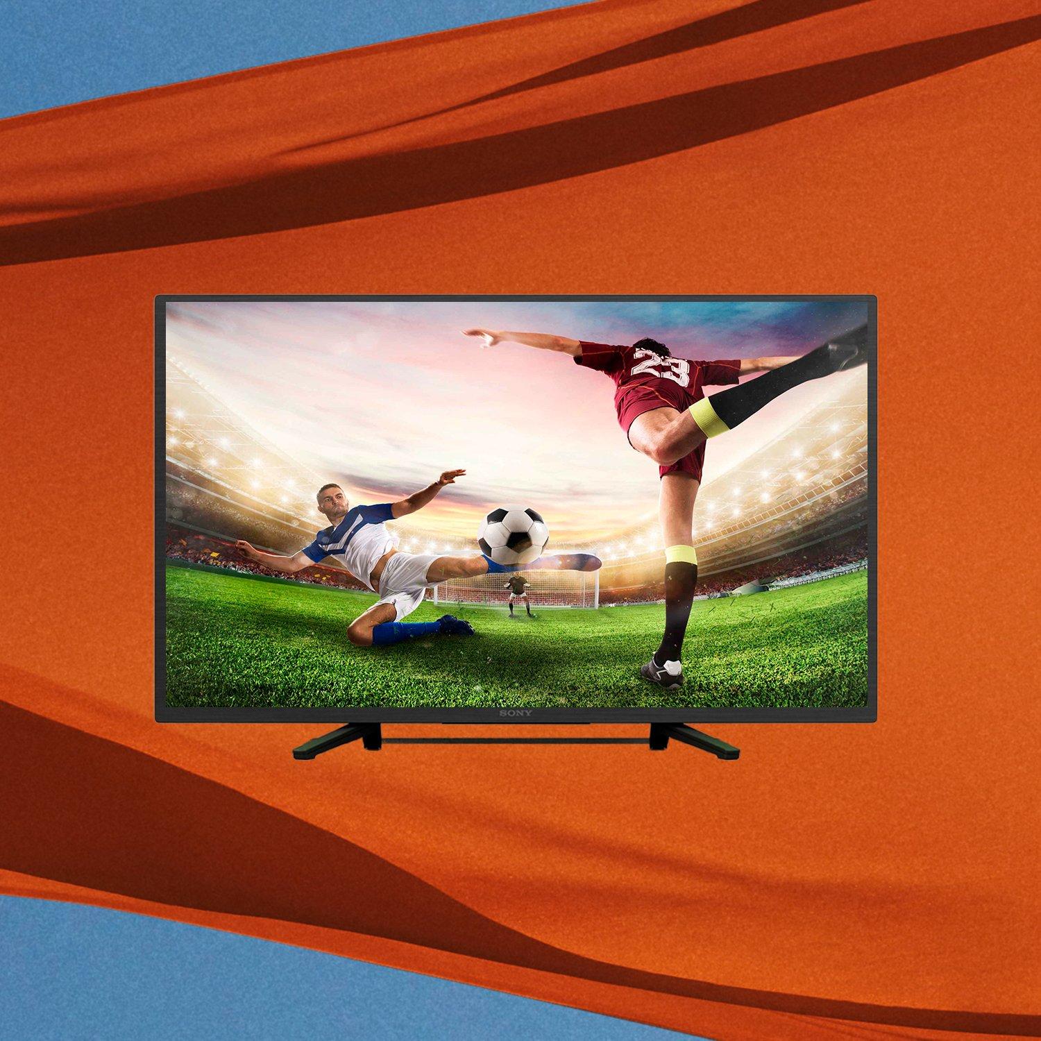 A TV in front of an orange cloth outdoors