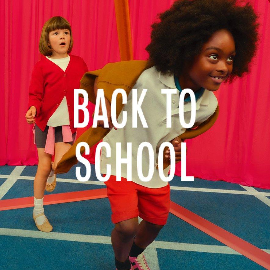 Boy and girl models dressed in schoolwear