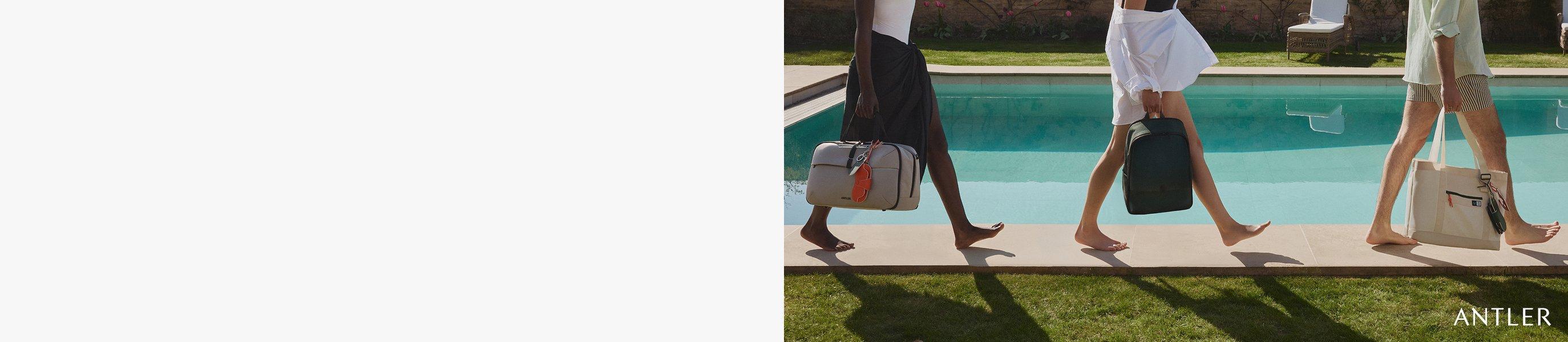 Three models, each holding an Antler bag, along a pool