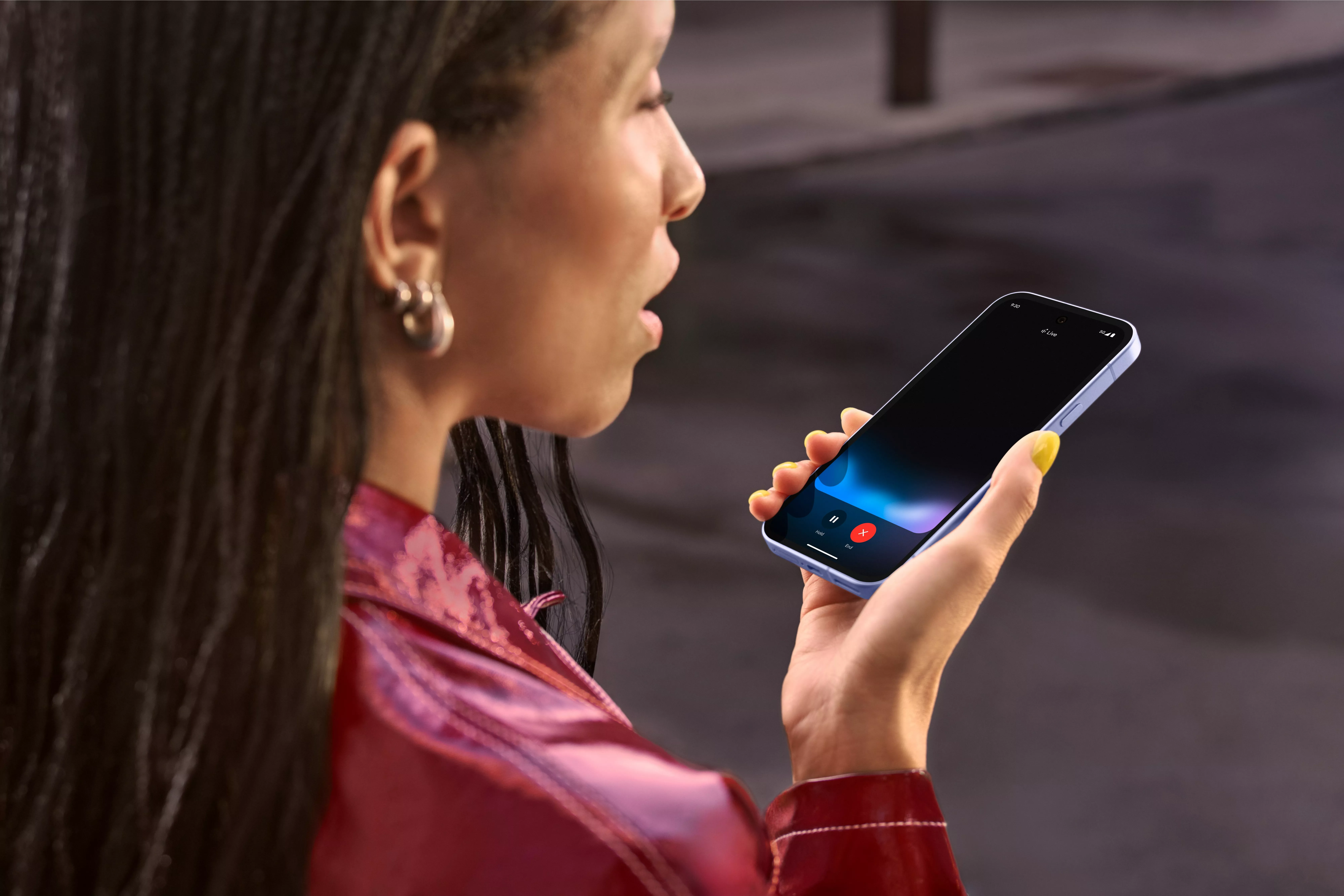 Woman using smartphone voice assistant outdoors, close-up side view, modern mobile technology communication concept