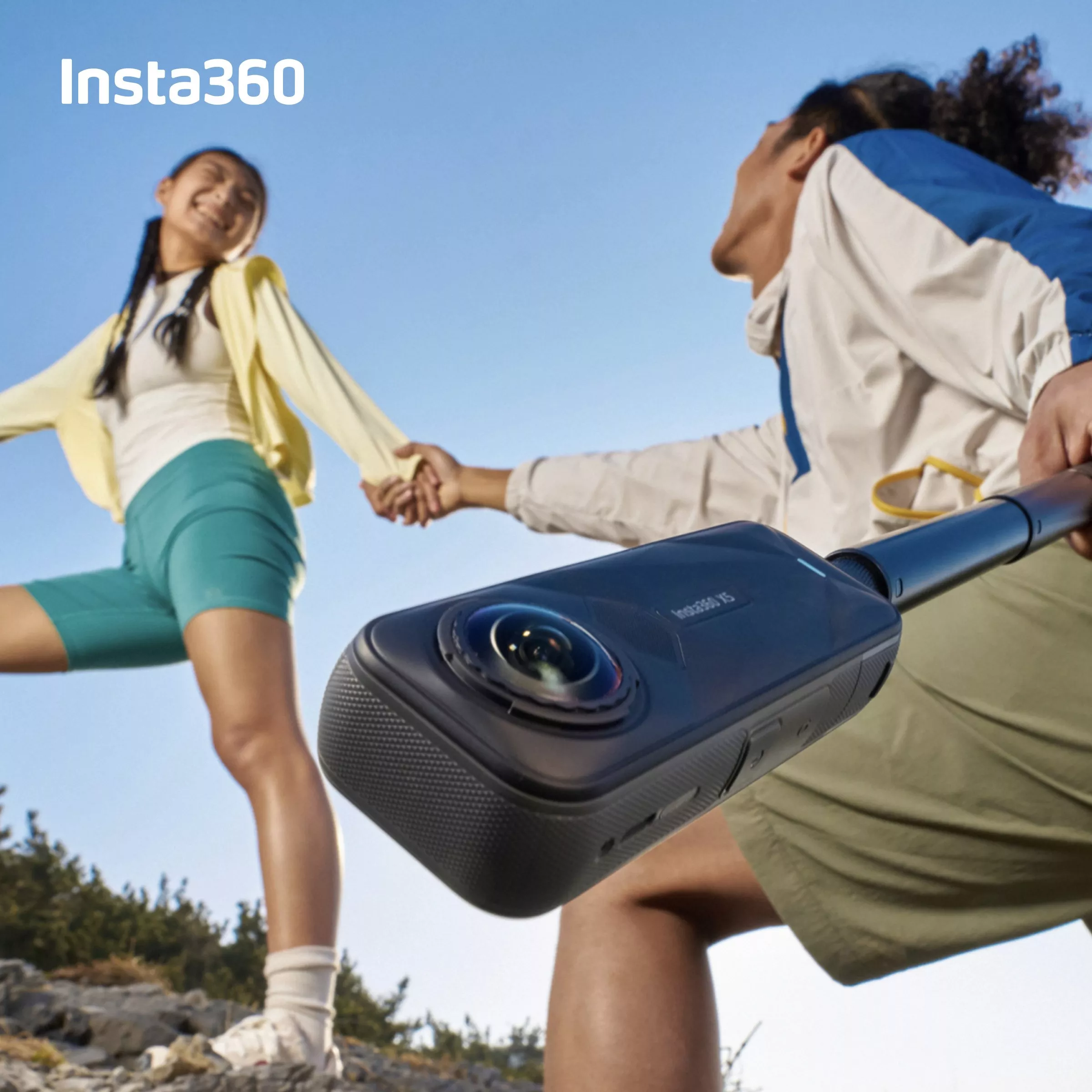 Two people holding hands with an insta 360 in the other hand