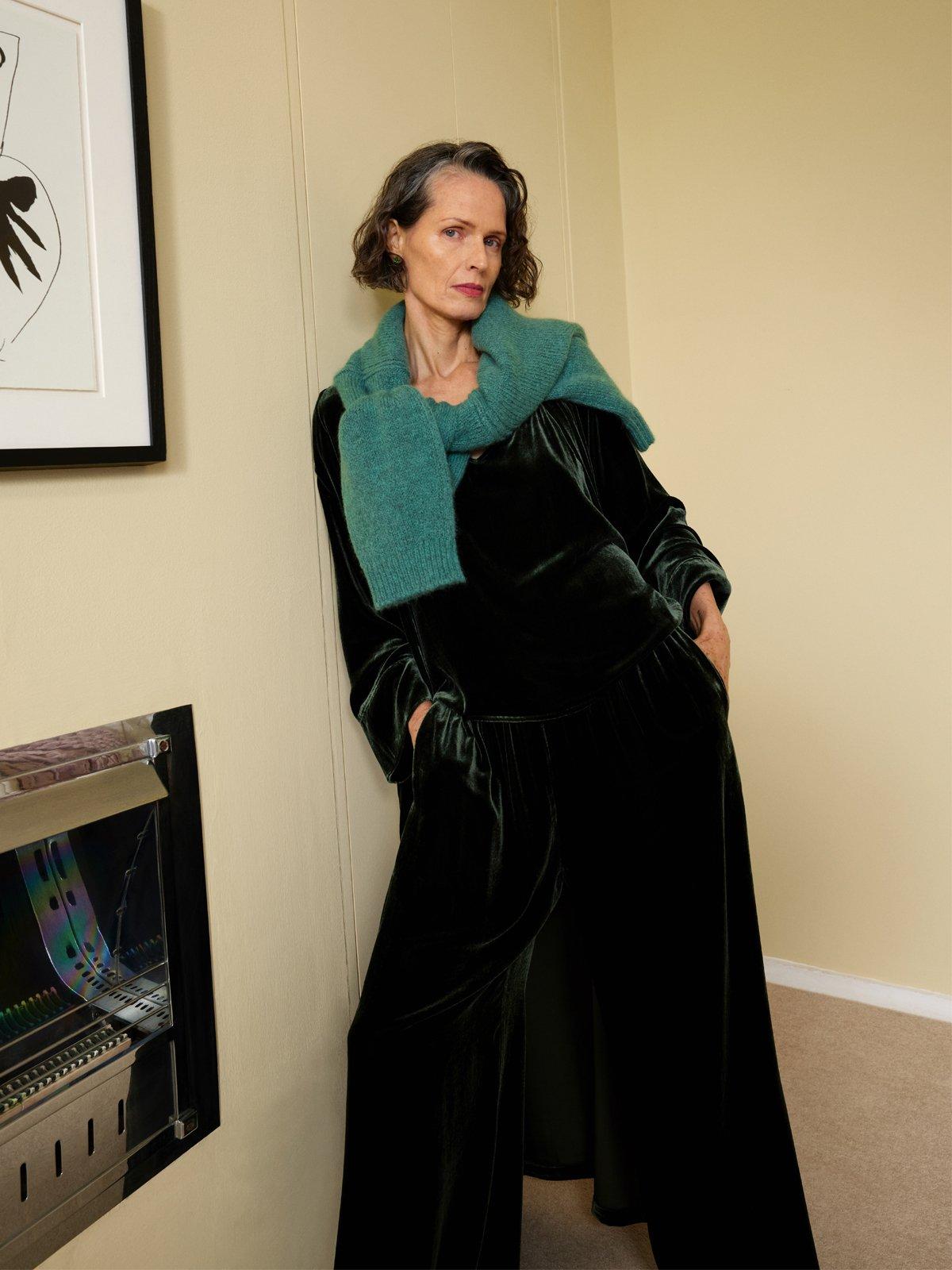 Image of a lady with a cashmere jumper wrapped around her shoulders