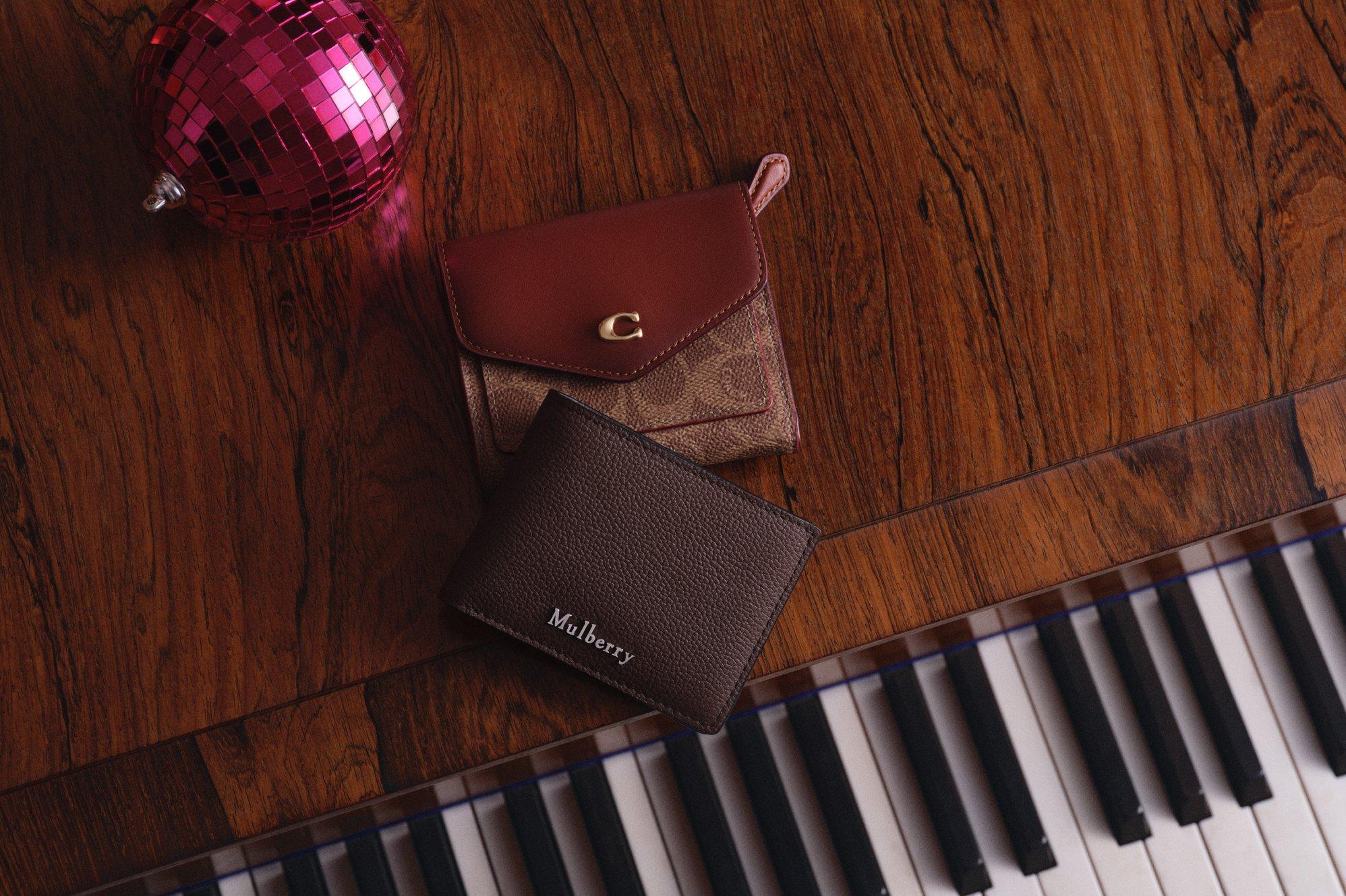 A mulberry purse ontop of a piano