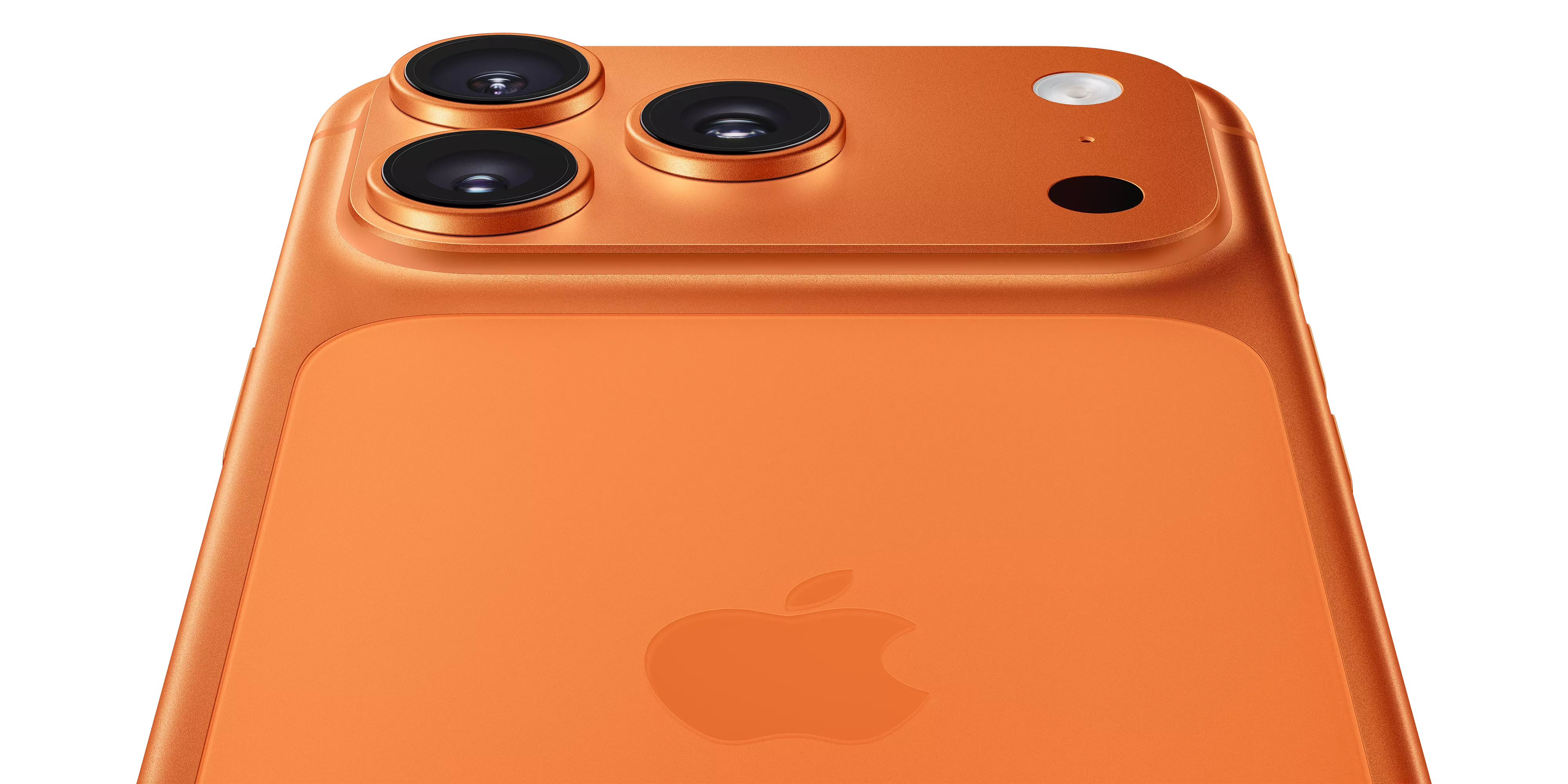 Close-up of orange iPhone rear with triple camera lenses and flash, showing Apple logo on back panel