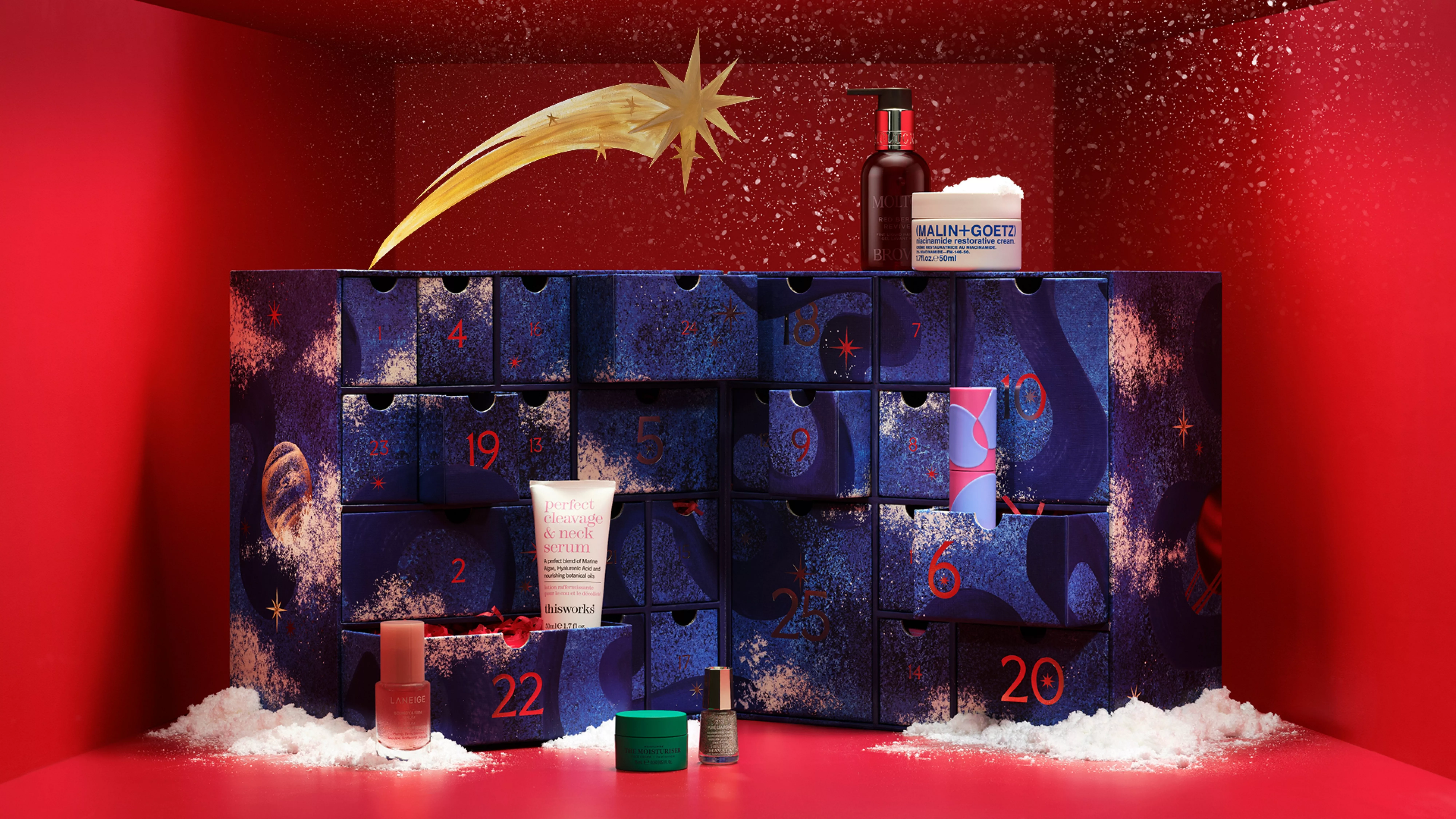Luxury beauty advent calendar with numbered drawers, skincare and makeup gifts, festive red background and snowflakes