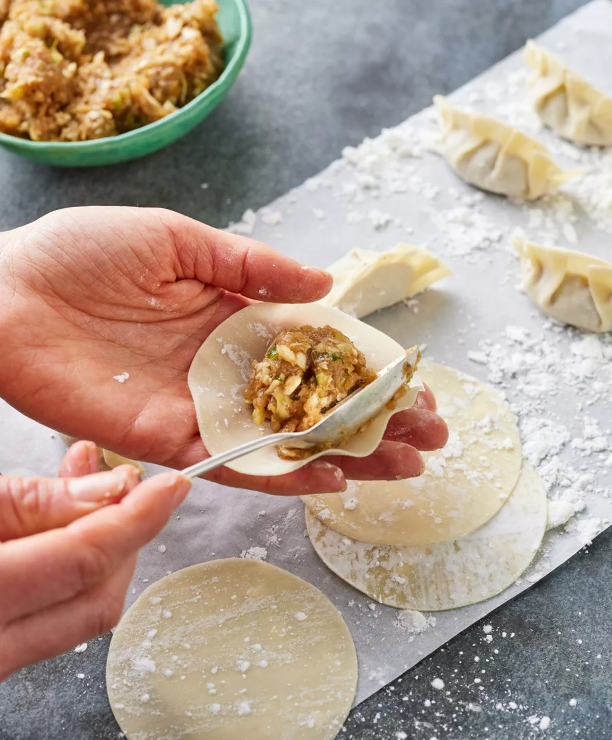 Person adding filling to a gyoza