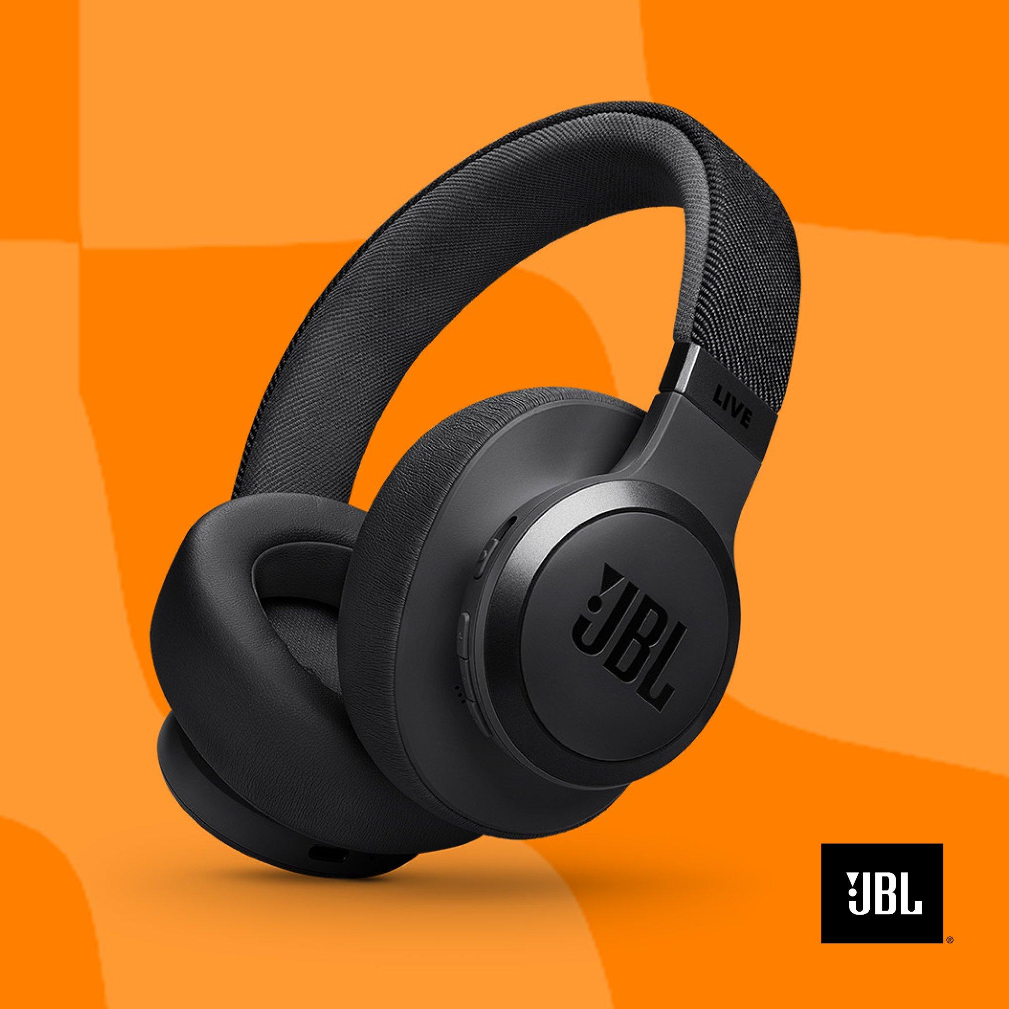 A black JBL headphones on an orange background.