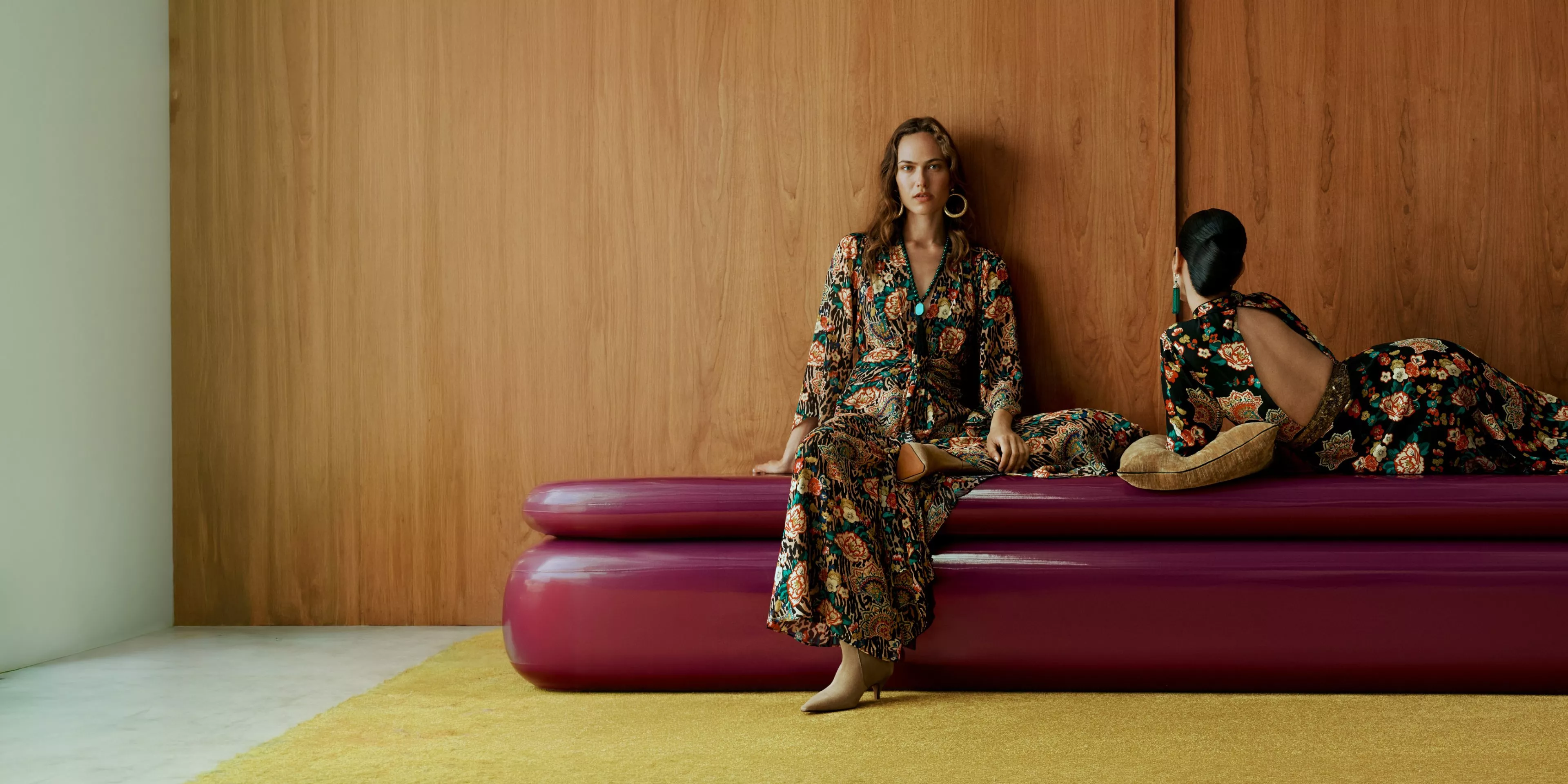 Two women wearing dresses from the coming soon John Lewis x RIXO collaboration
