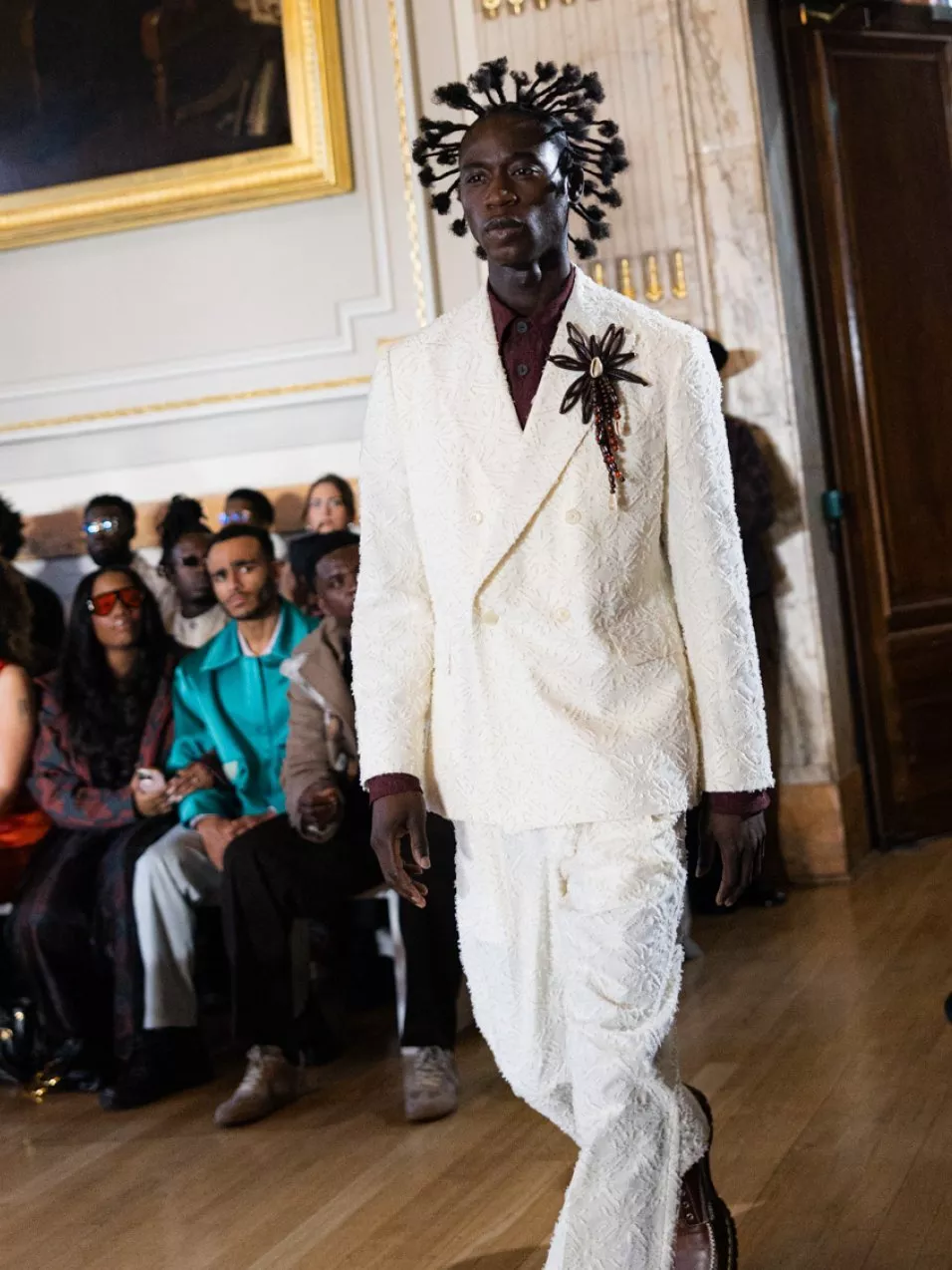 image of a model in london fashion week wearing labrum white suit