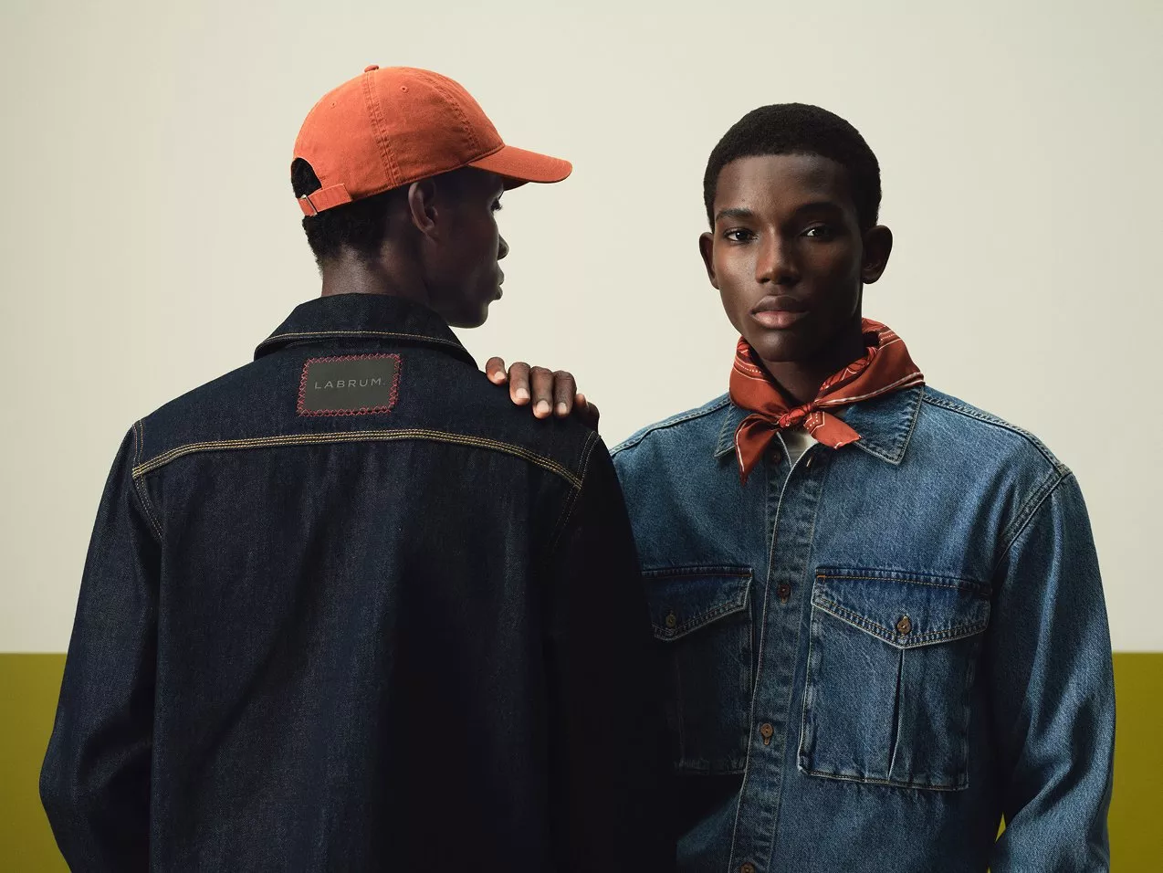 Two male models wearing denim from the John Lewis x LABRUM collection