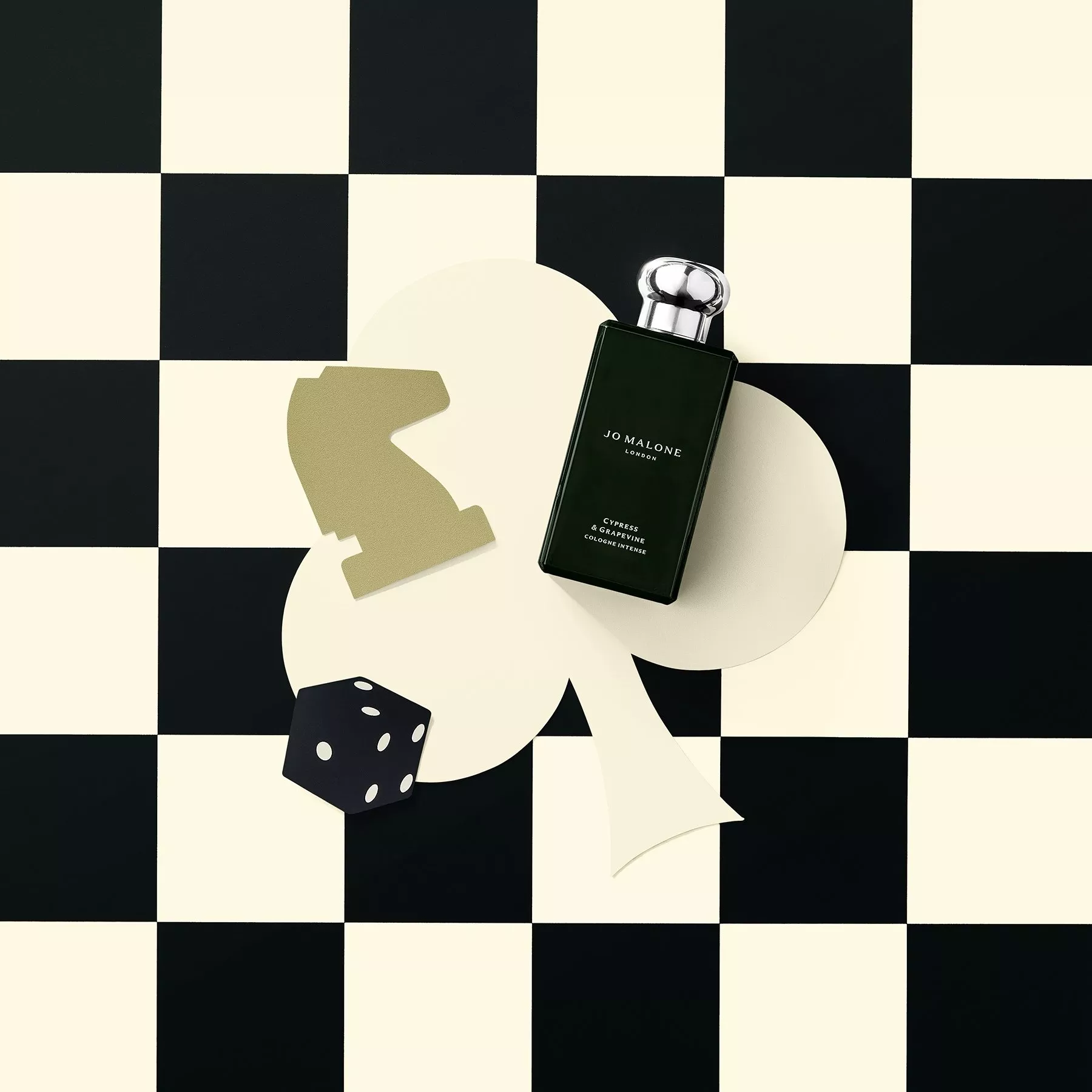 a bottle of mens Jo Malone London fragrance on a checkered background