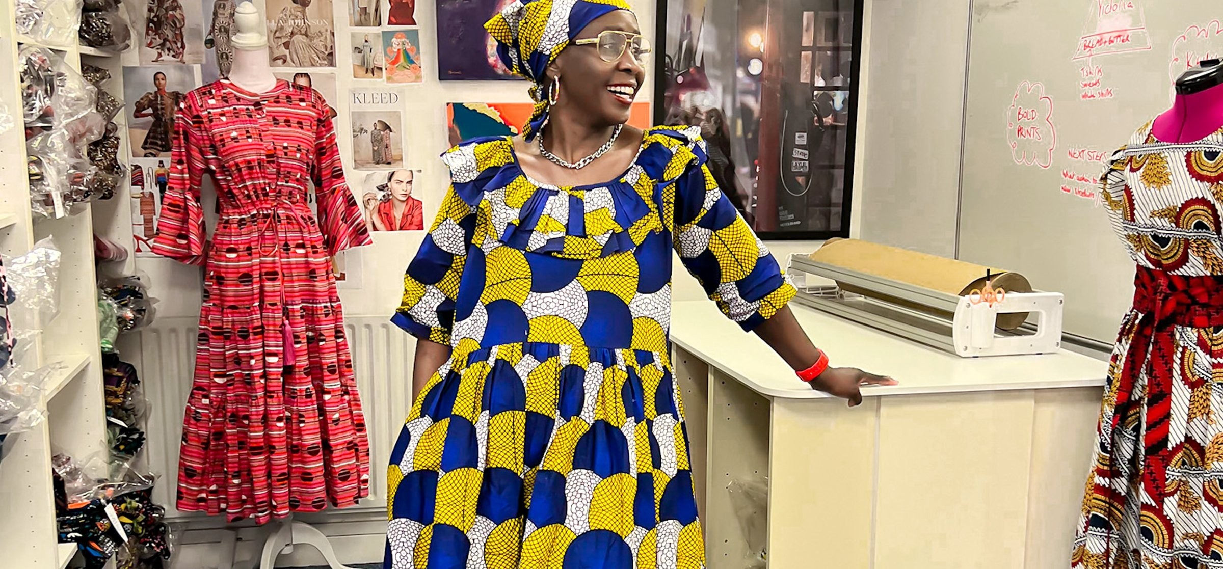 Kemi Telford in her office wearing one of her designer dresses