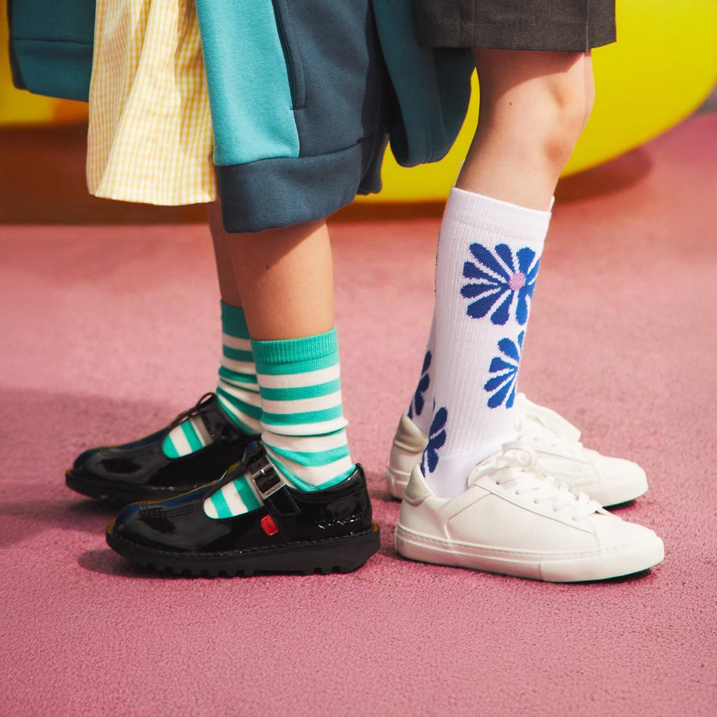 children's wearing black and white school shoes