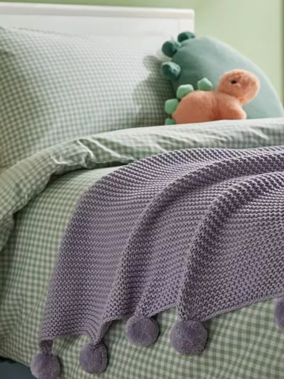 purple throw on green ginham bedding