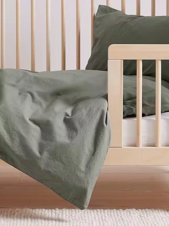 green duvet cover on kids bed