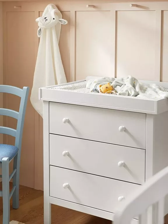 white chest of drawers in baby's bedroom
