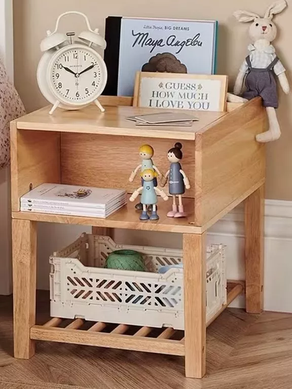 bedside table with kids toys and clock