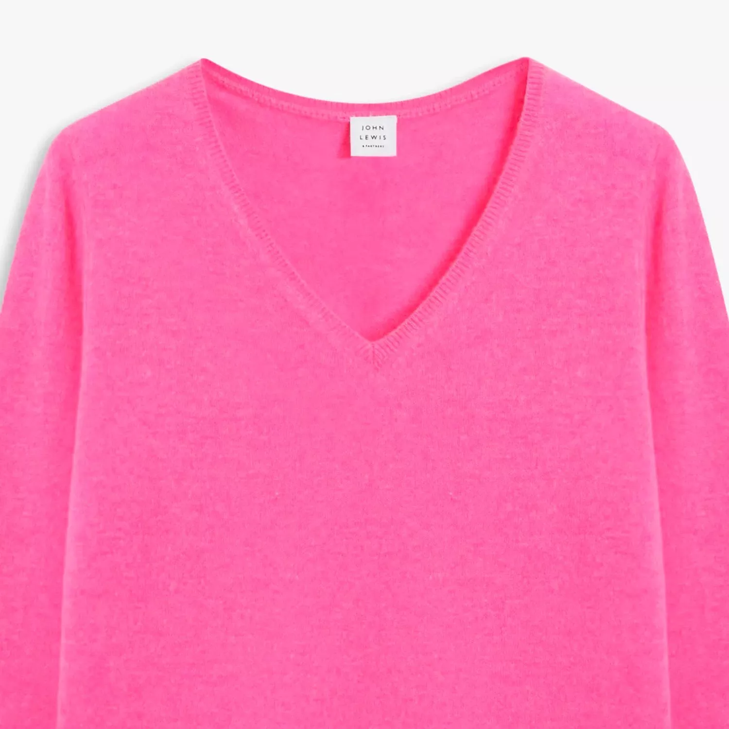 Bright pink V-neck knit jumper close-up, soft long-sleeve womenswear knitwear on a clean white background