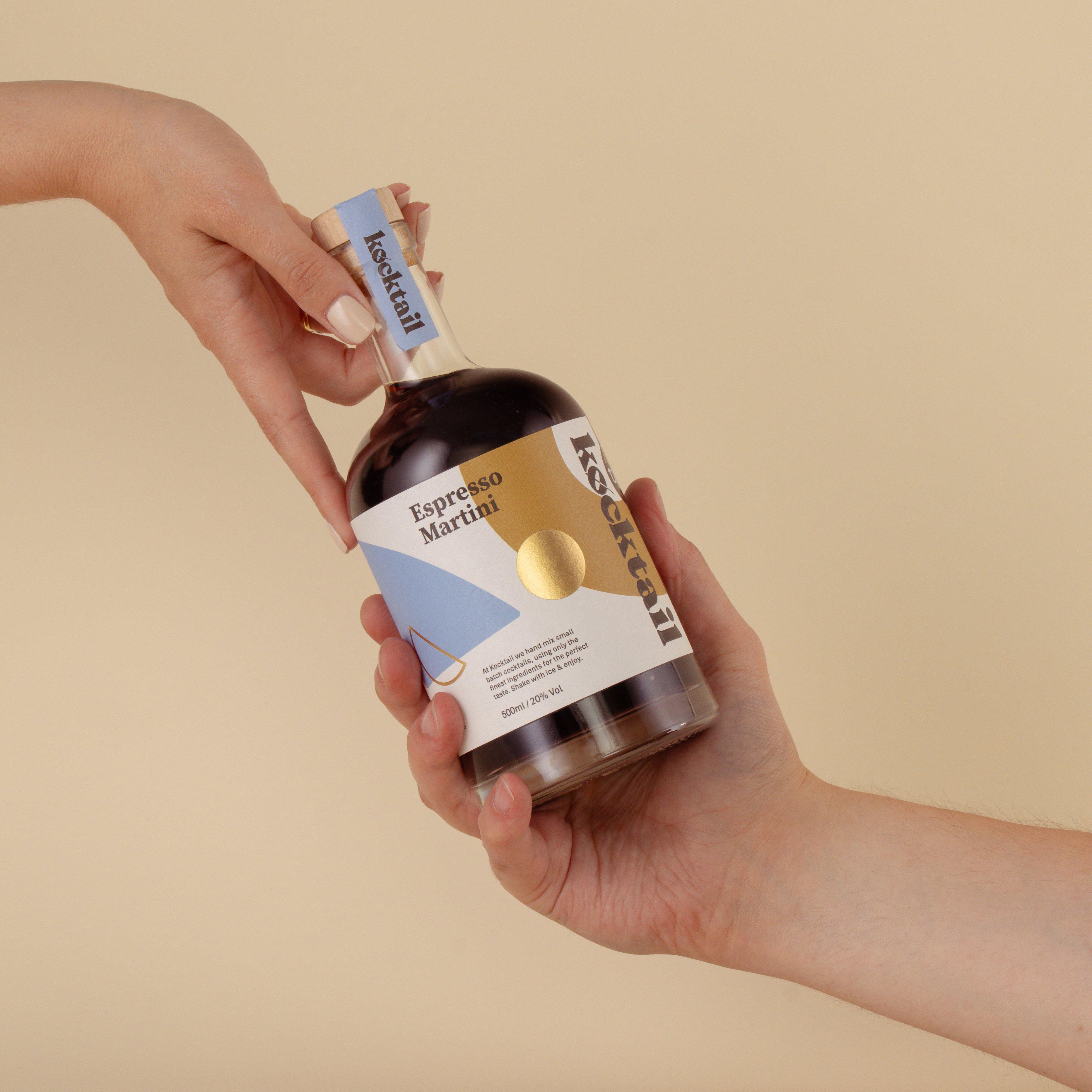 bottle of Kocktail being held by two hands