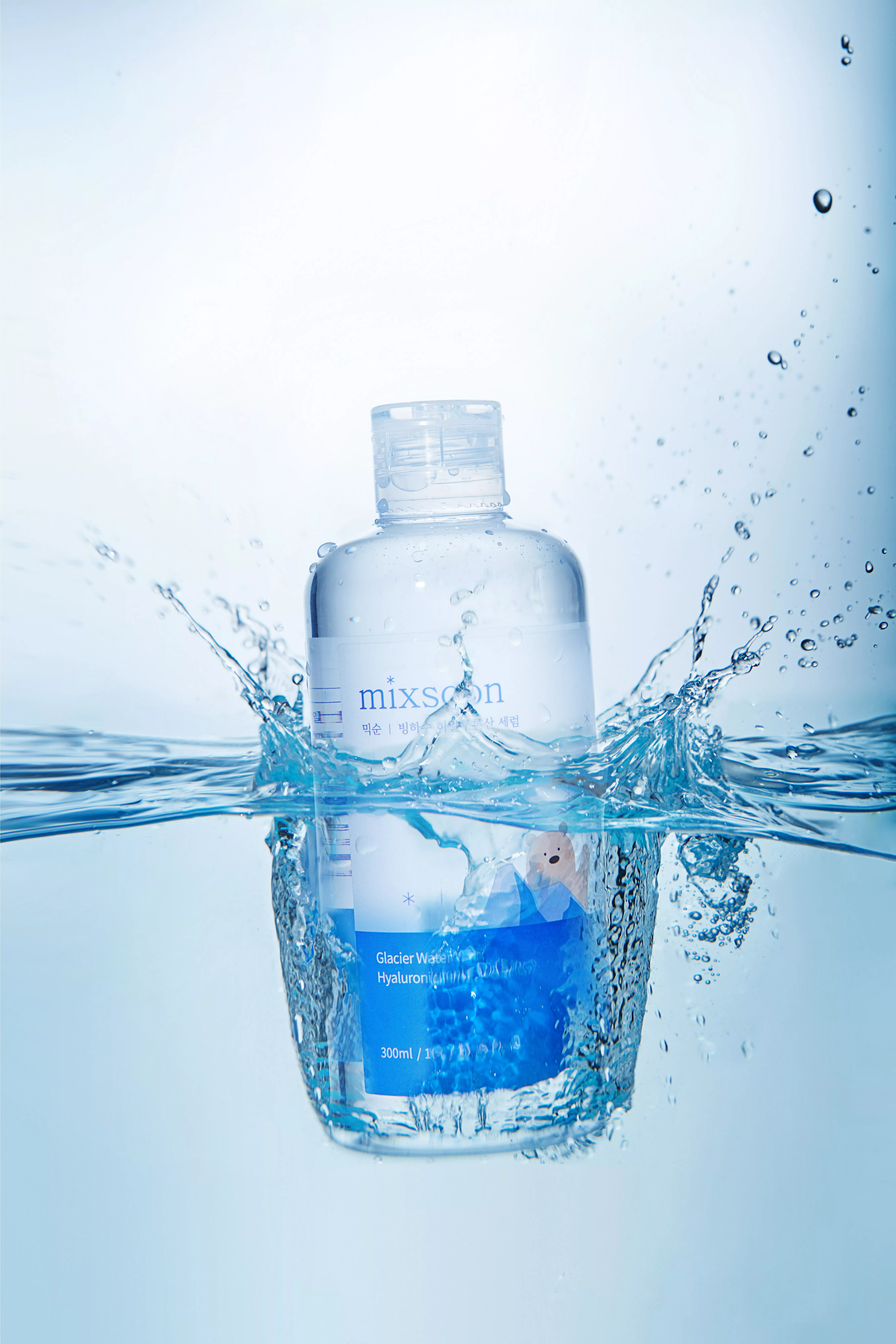 Mixsoon Glacier Water Hyaluronic Acid serum bottle splashing in water, hydrating Korean skincare product photo