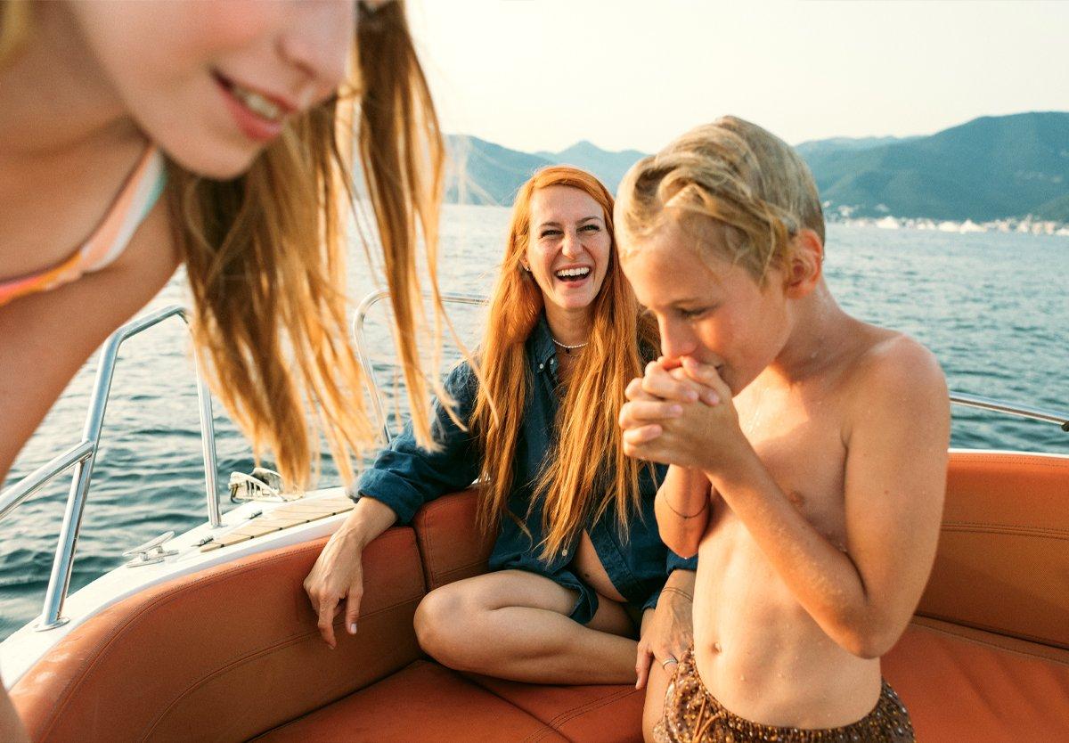 women and two kids on a boat