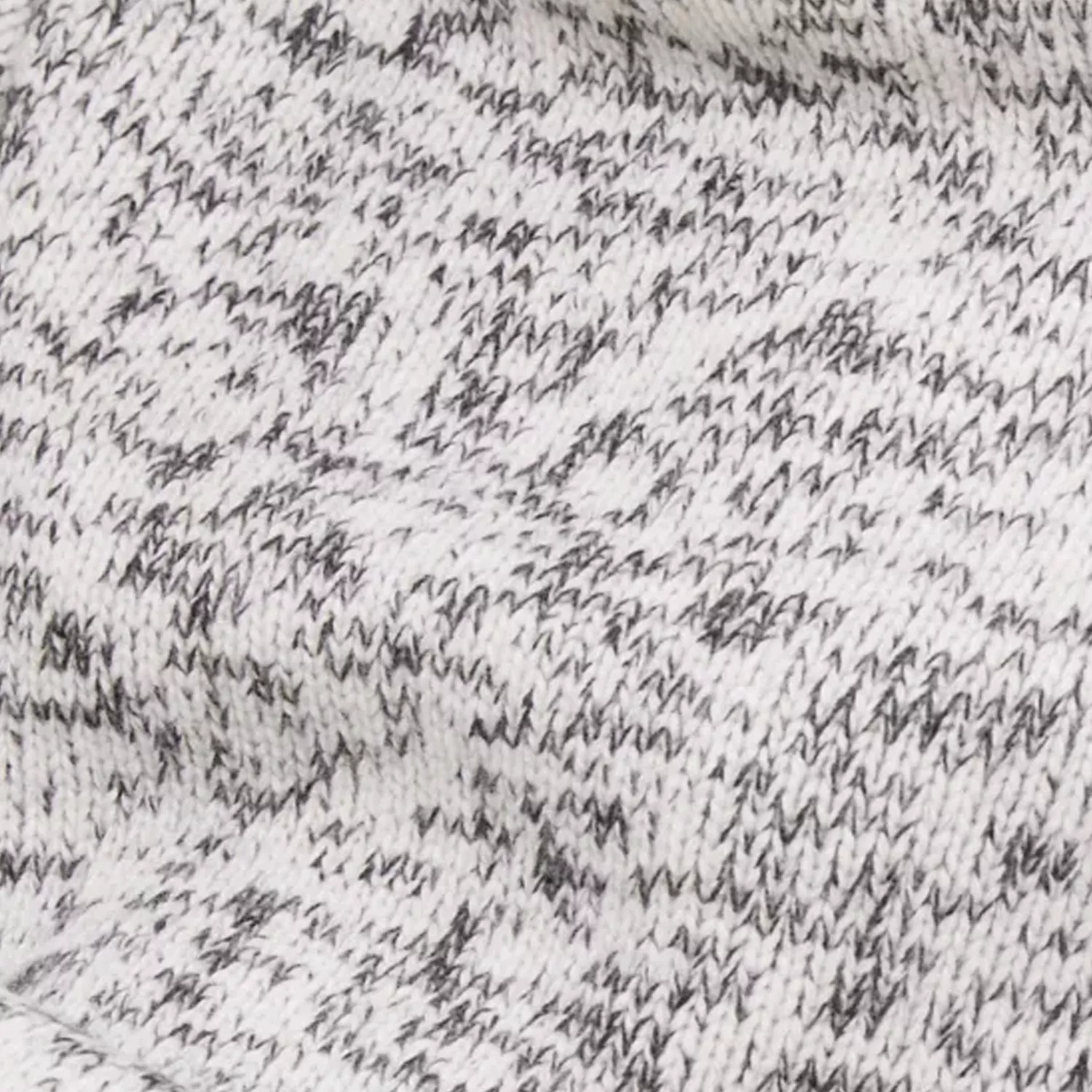 Close-up of grey and white knitted fabric texture, soft marled wool pattern for cosy winter clothing background