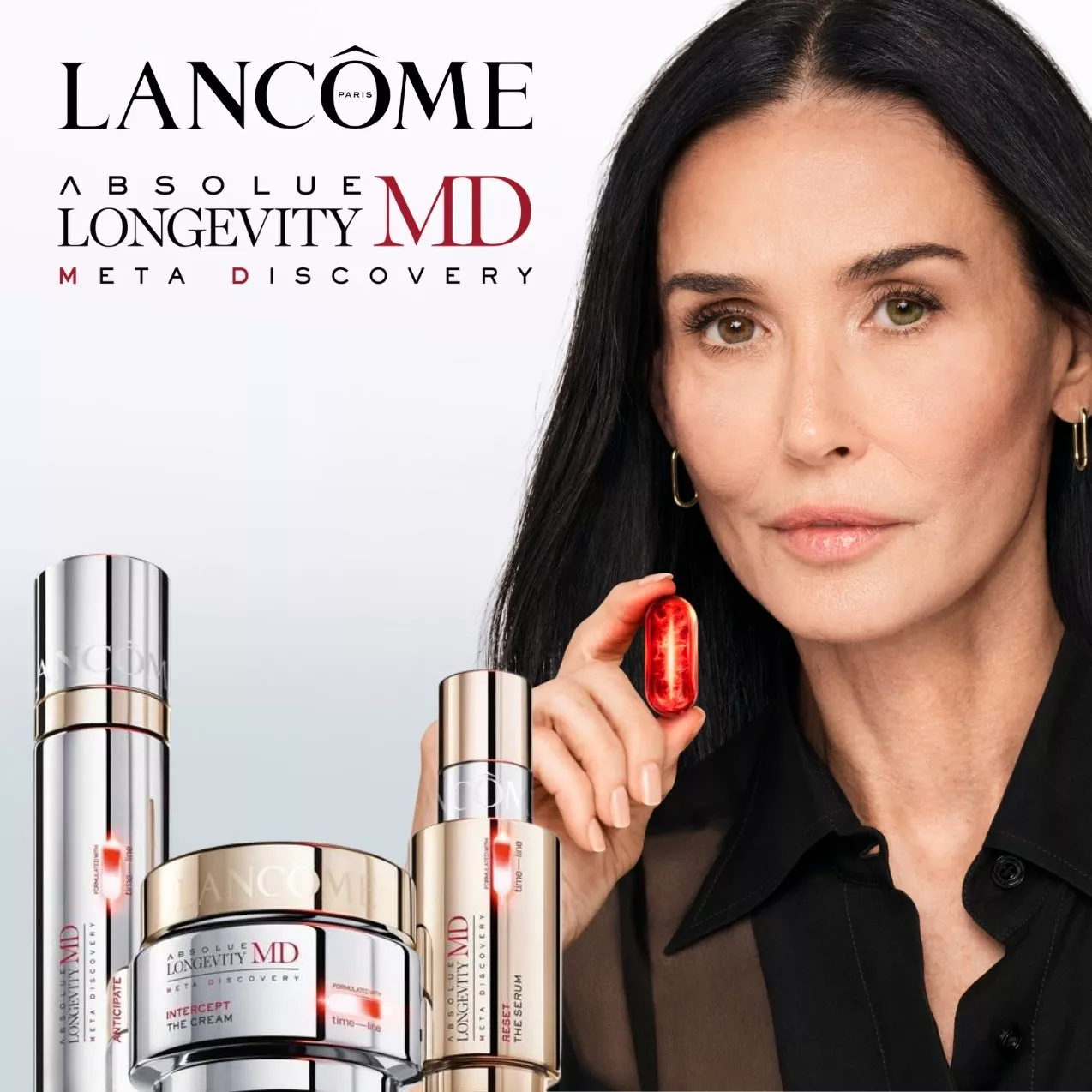 Lancôme Absolue Longevity MD Meta Discovery skincare advert with serum bottles, cream jar and model holding red capsule.