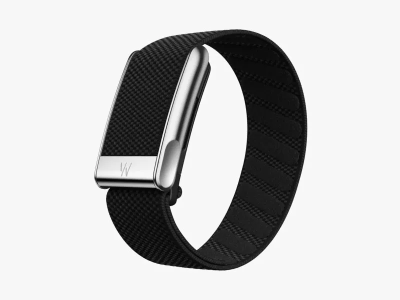 WHOOP Life MG Health & Fitness Wearable on a grey background