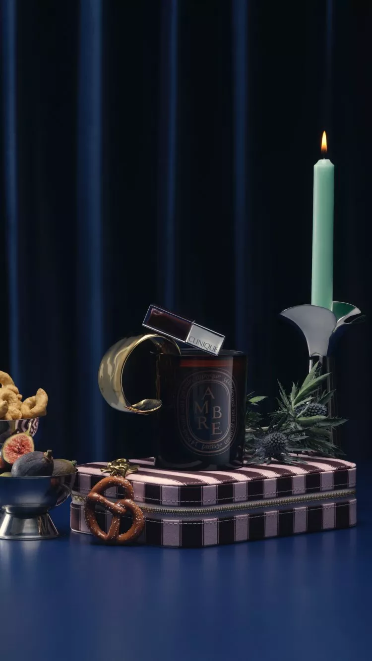 a comp of different gifts ranging from home to beauty with a blue curtain background