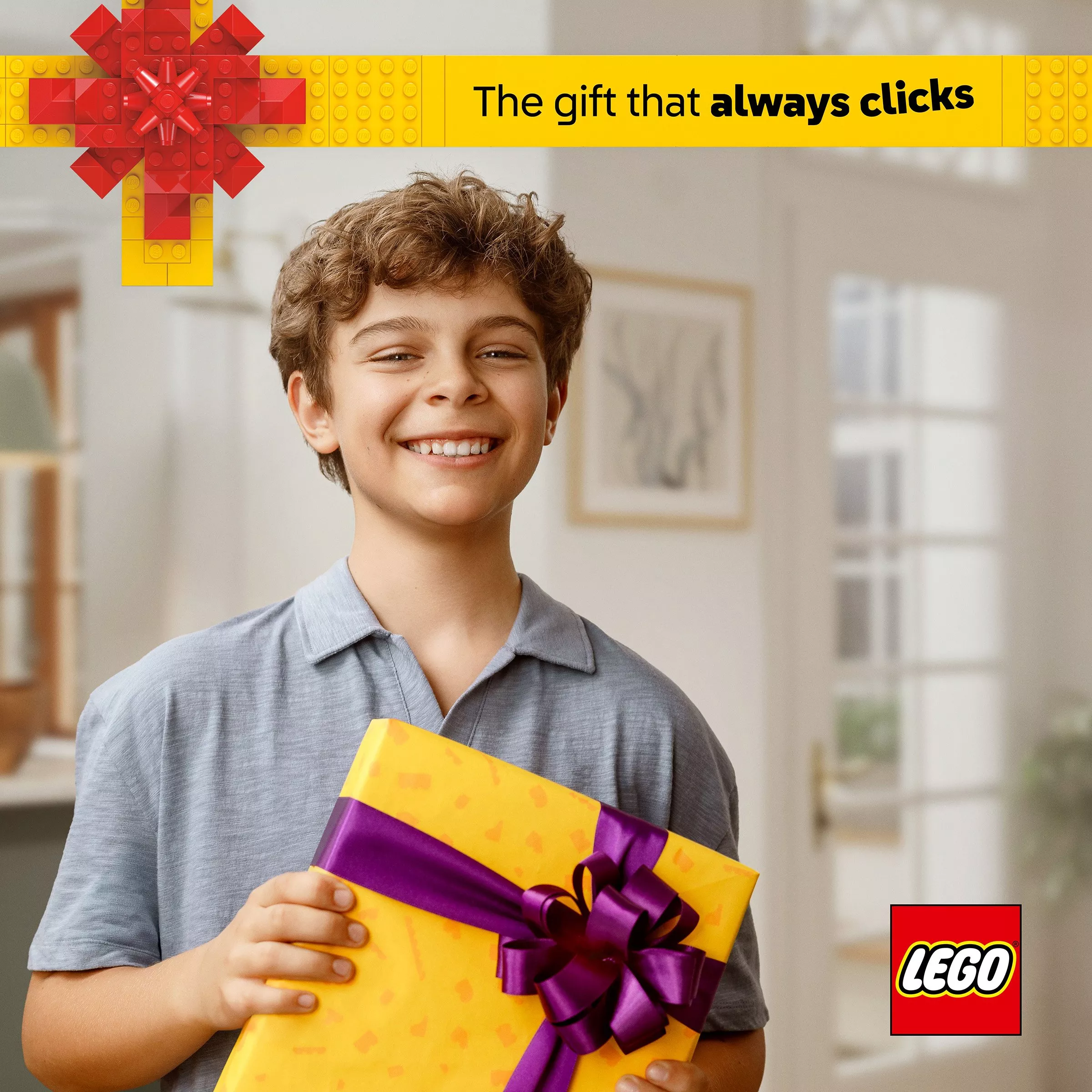 image of boy holding on present box